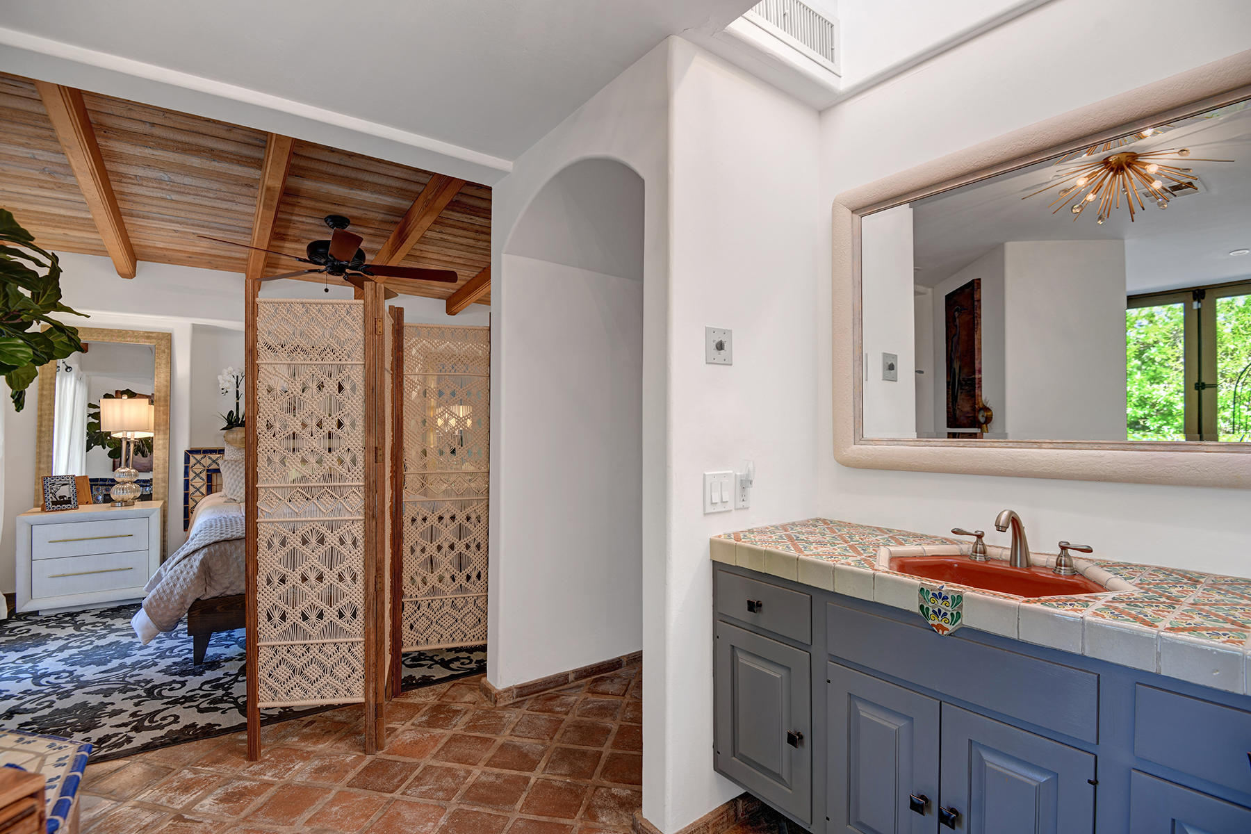 71677 Tunis Road Rancho Mirage, CA 92270 - Photo 19 of 37 a bathroom with a sink and a mirror