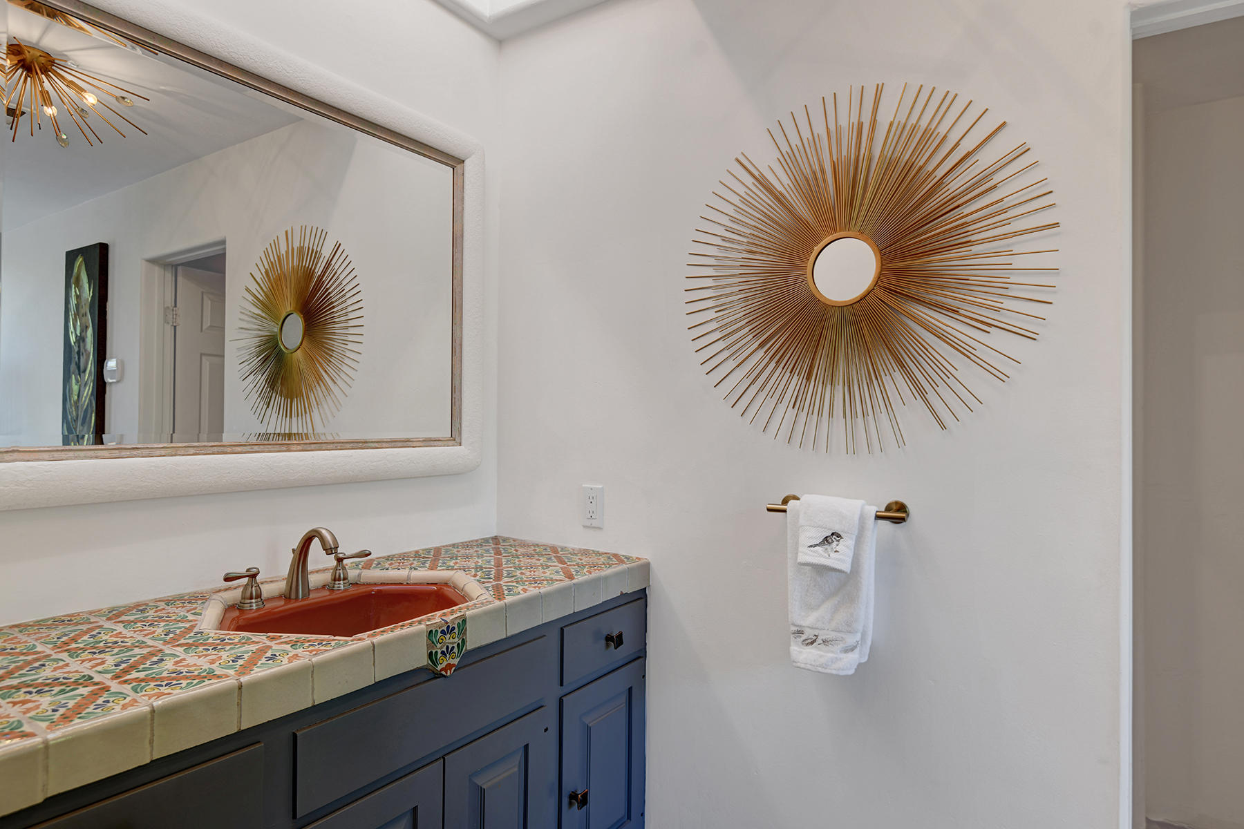 71677 Tunis Road Rancho Mirage, CA 92270 - Photo 20 of 37 a bathroom with a sink and a mirror