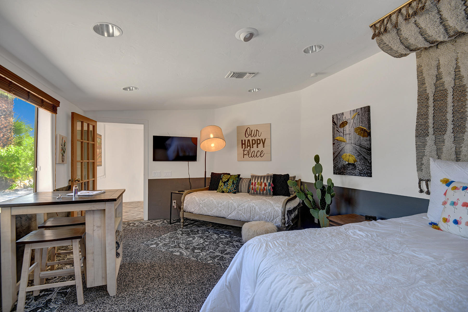 71677 Tunis Road Rancho Mirage, CA 92270 - Photo 25 of 37 a bedroom with furniture and a flat screen tv