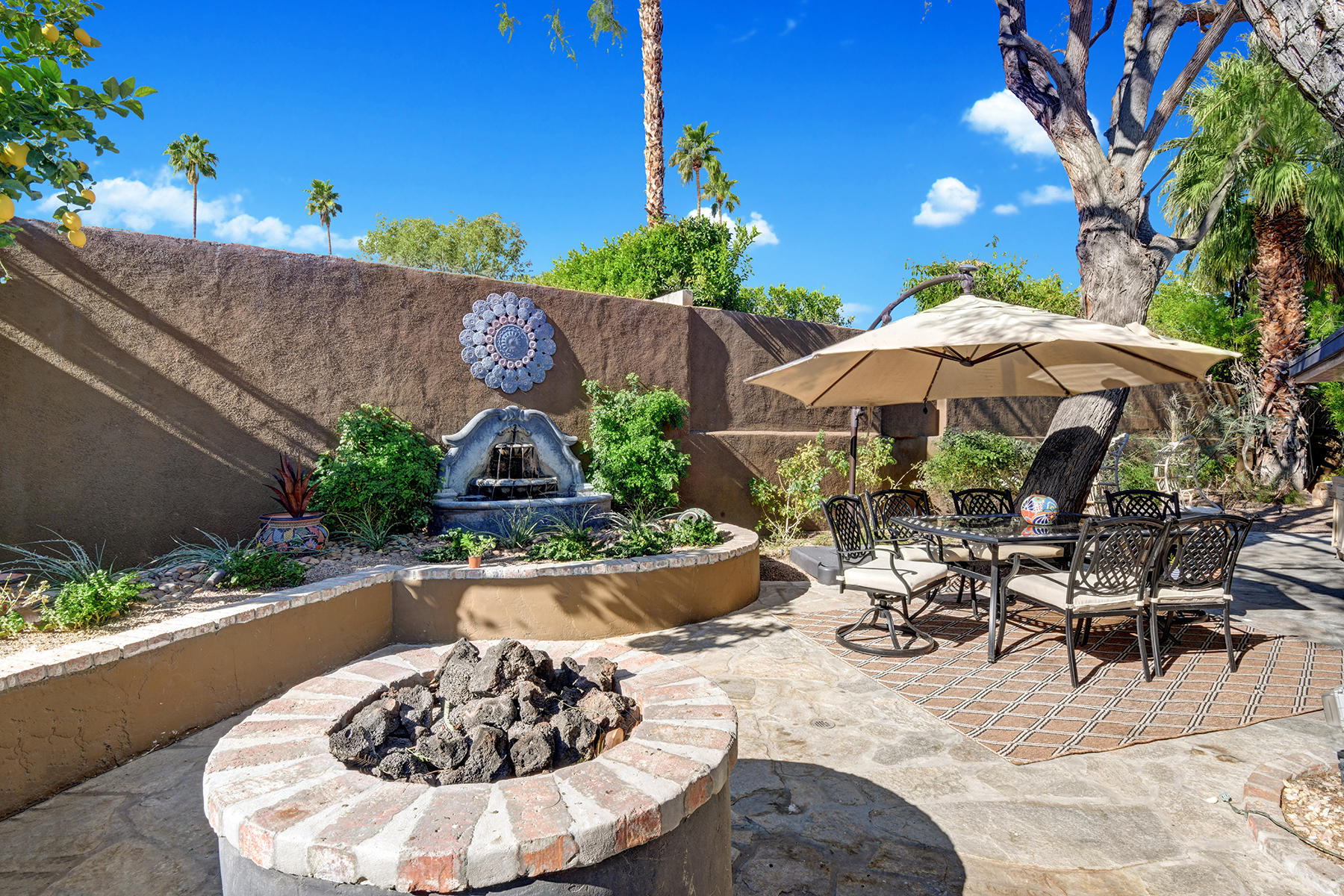 71677 Tunis Road Rancho Mirage, CA 92270 - Photo 27 of 37 a view of a backyard with plants and patio