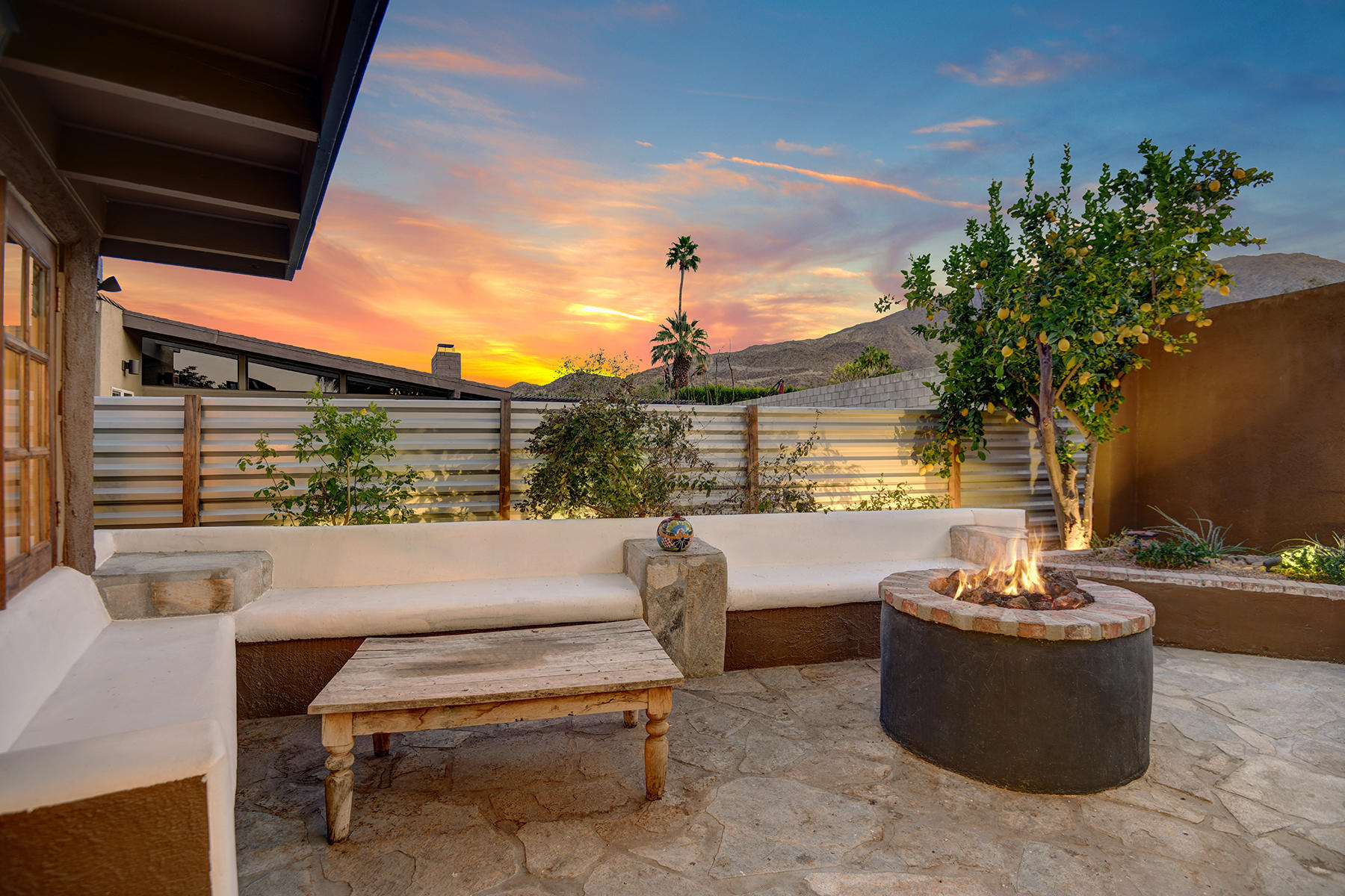 71677 Tunis Road Rancho Mirage, CA 92270 - Photo 30 of 37 a view of a patio with couches chairs and a potted plant