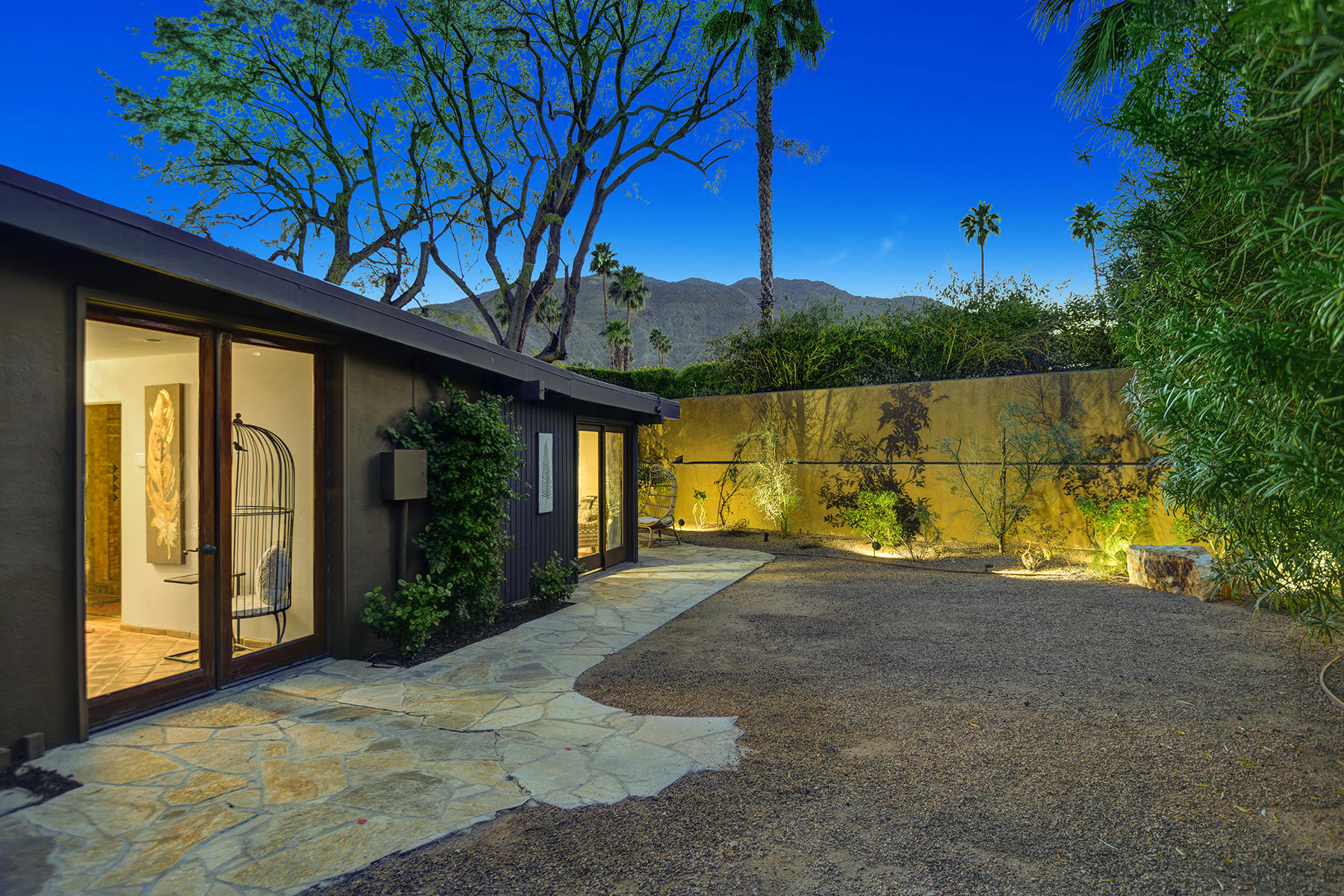 71677 Tunis Road Rancho Mirage, CA 92270 - Photo 33 of 37 a view of a house with backyard and tree in front of it