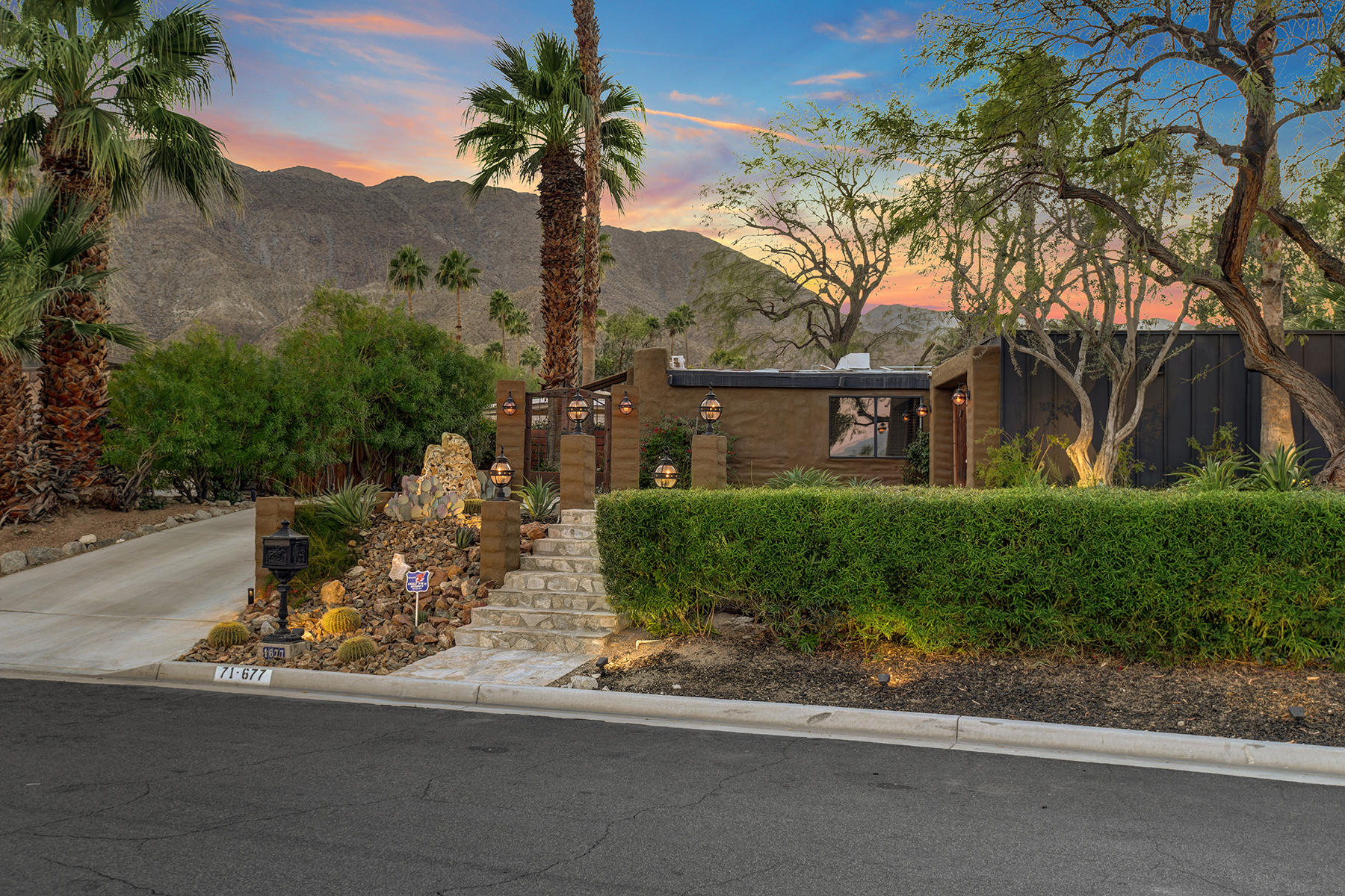 71677 Tunis Road Rancho Mirage, CA 92270 - Photo 37 of 37 a front view of a house with a yard and garage