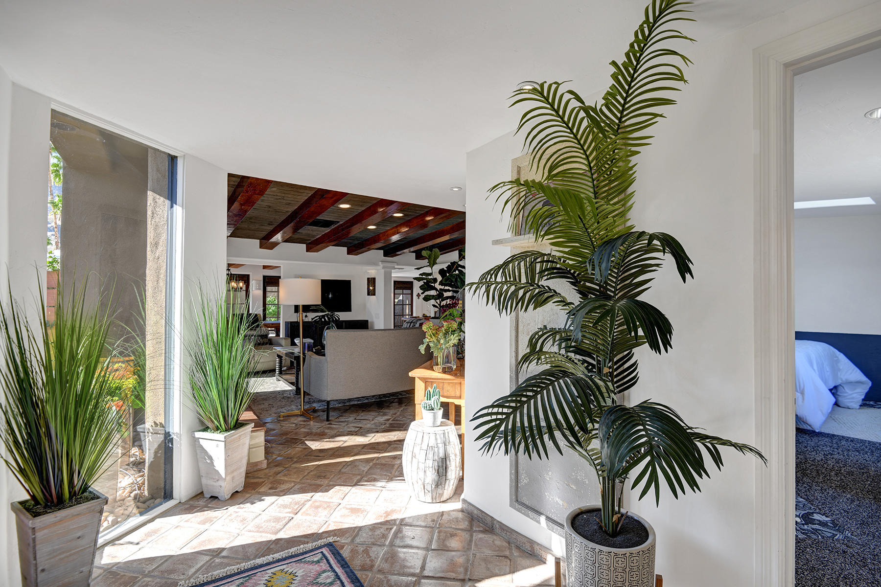 71677 Tunis Road Rancho Mirage, CA 92270 - Photo 6 of 37 a living room with furniture and a potted plant