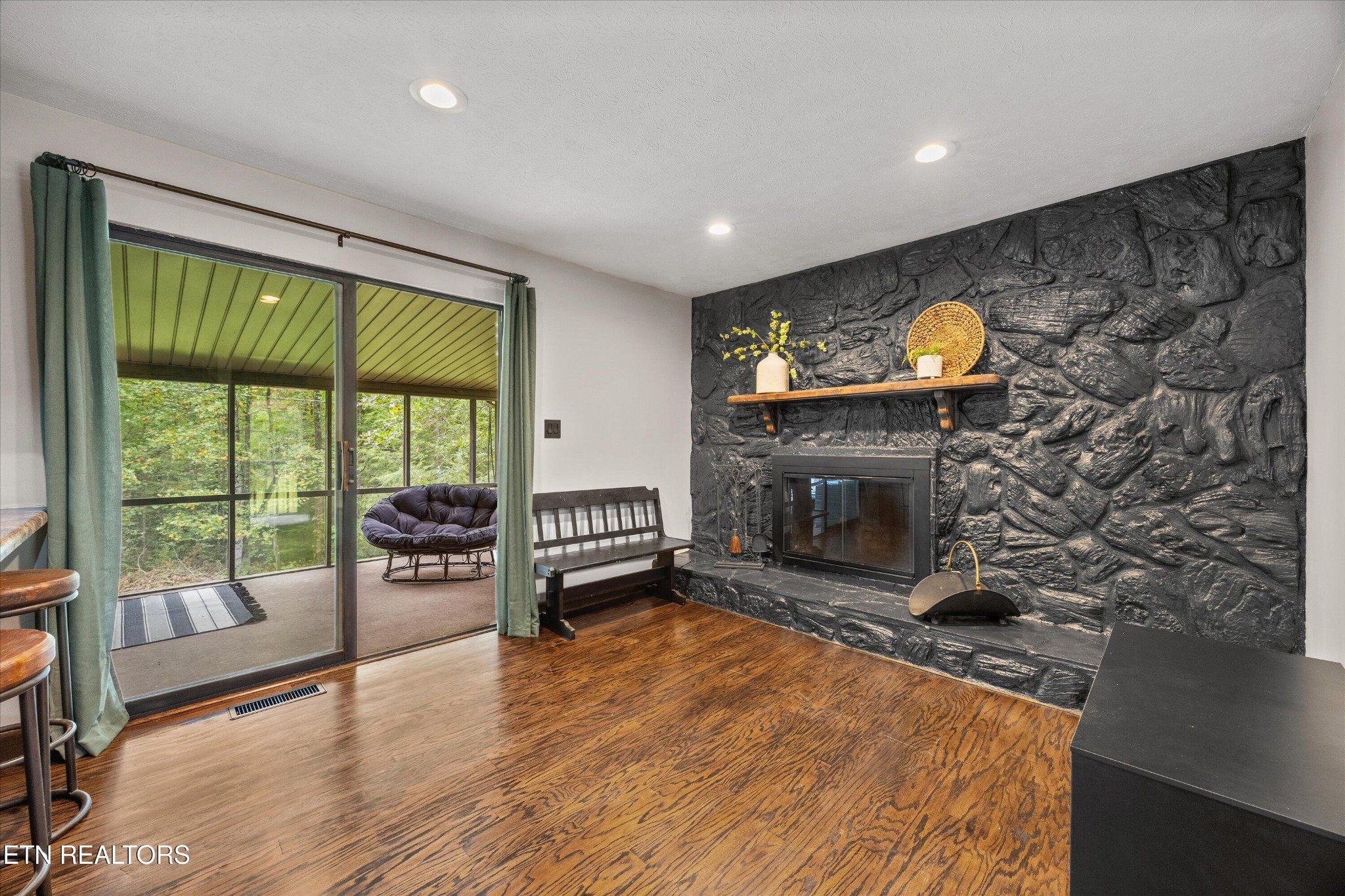 484 HC Smith Drive Oneida, TN 37841 - Photo 12 of 35 a living room with fireplace furniture and a large window