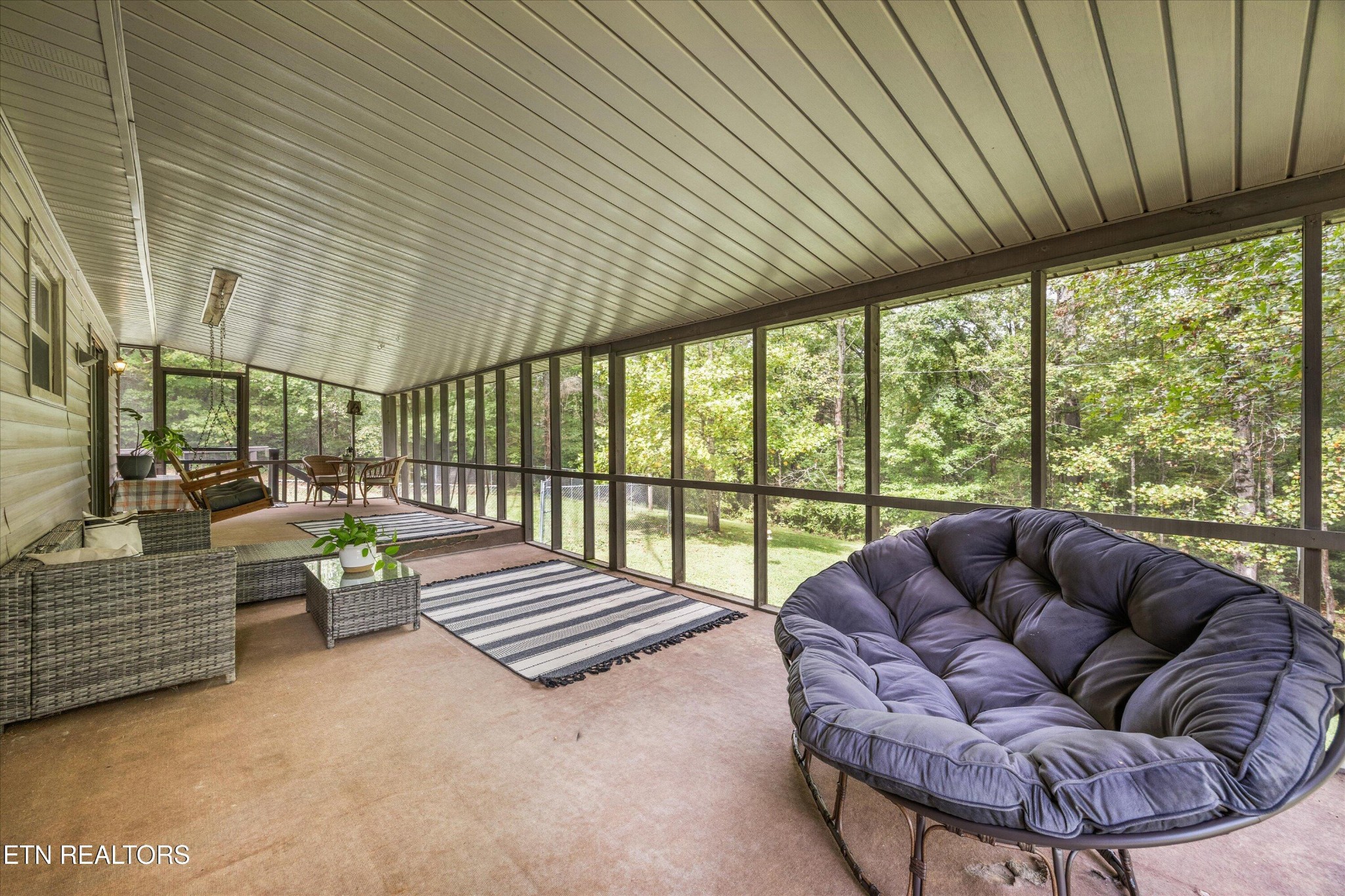 484 HC Smith Drive Oneida, TN 37841 - Photo 22 of 35 a balcony with furniture and a garden