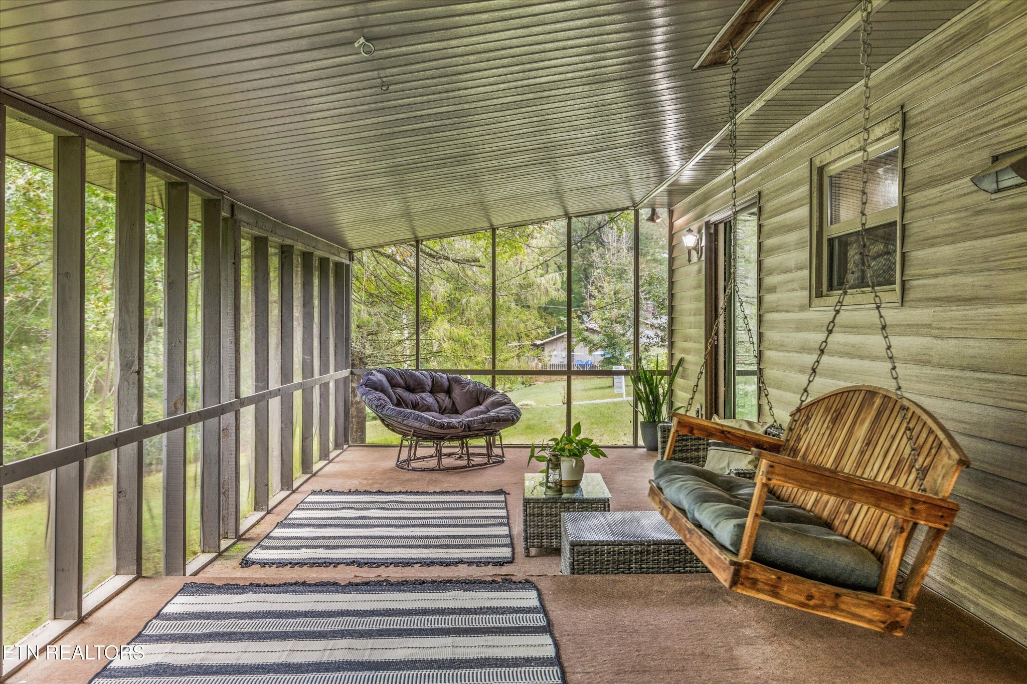 484 HC Smith Drive Oneida, TN 37841 - Photo 25 of 35 a balcony with furniture and large windows