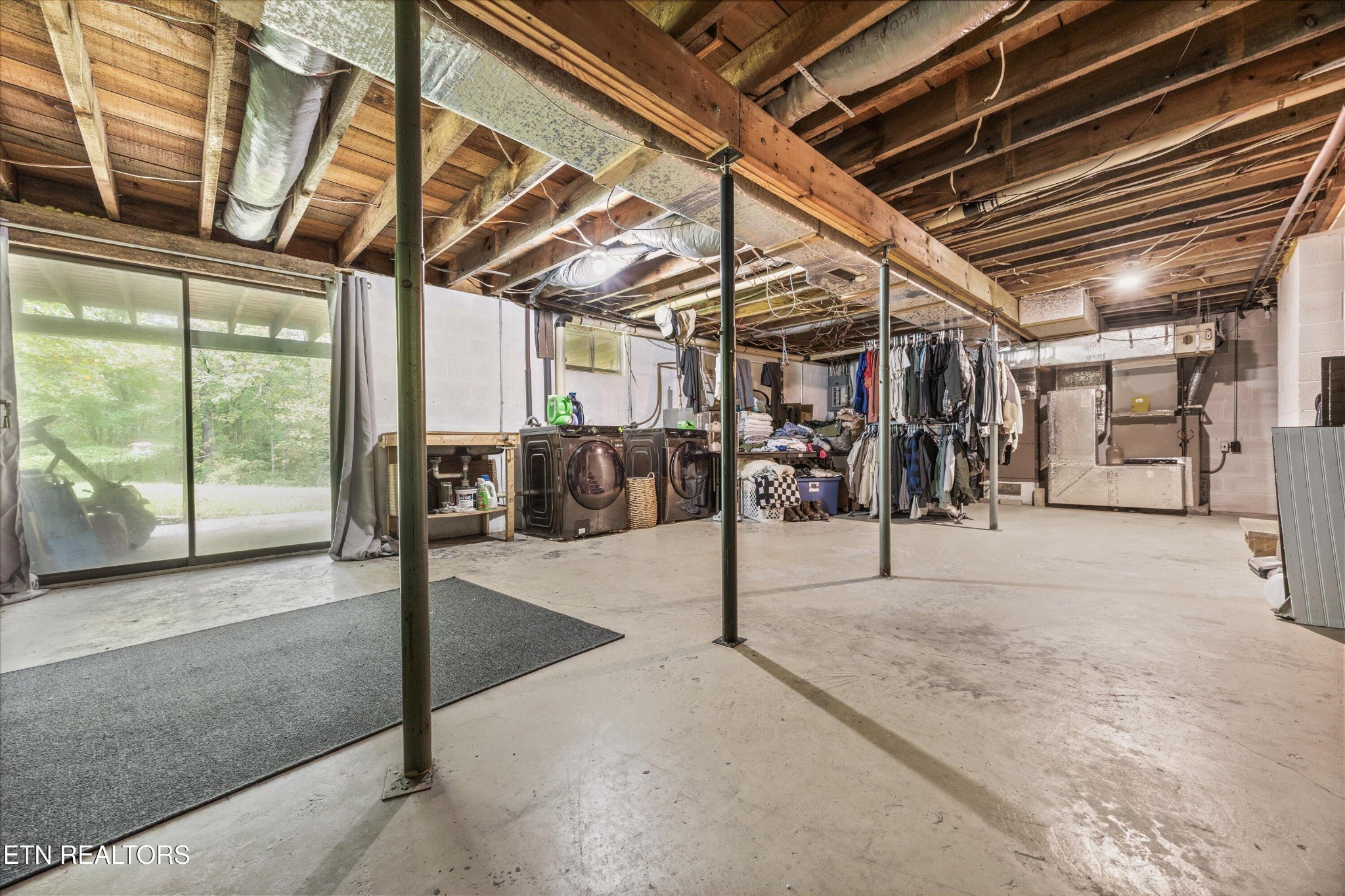 484 HC Smith Drive Oneida, TN 37841 - Photo 26 of 35 a view of a garage with wooden floor