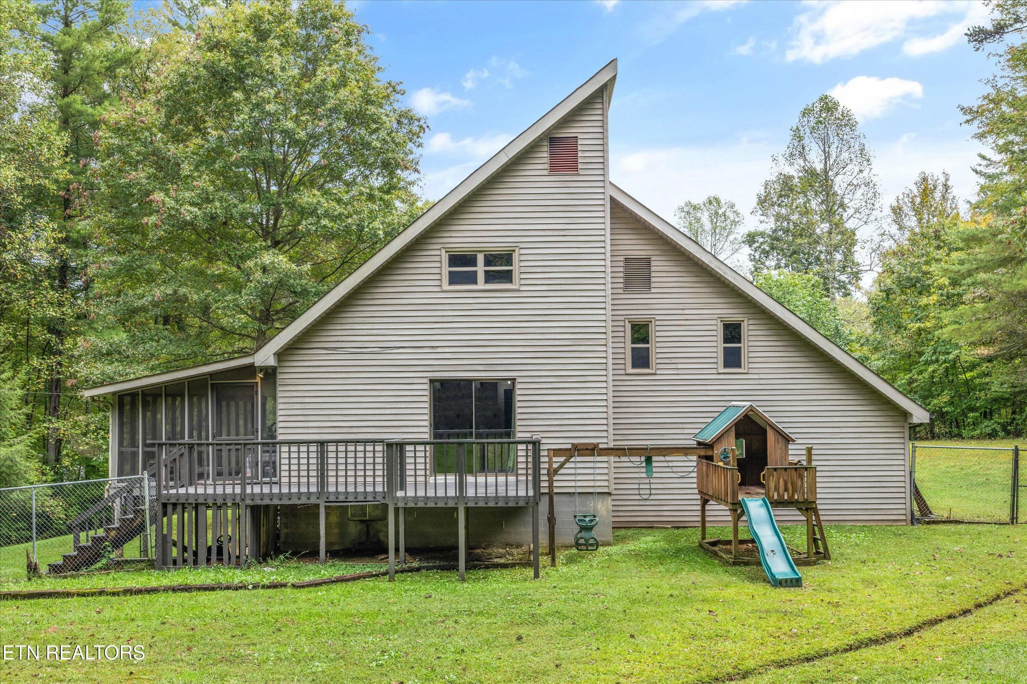484 HC Smith Drive Oneida, TN 37841 - Photo 29 of 35 a view of a house with a yard chairs and a yard