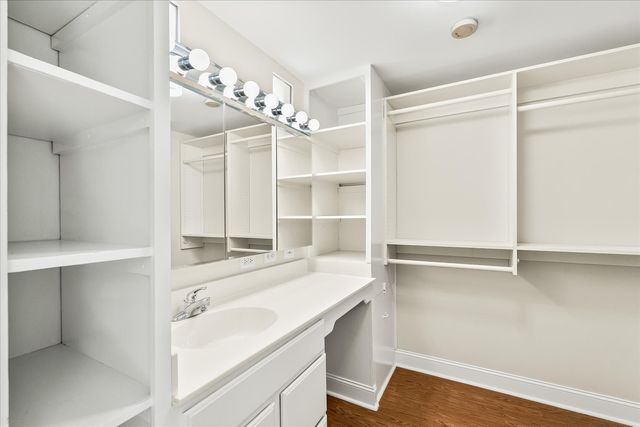 a room with a sink and a mirror