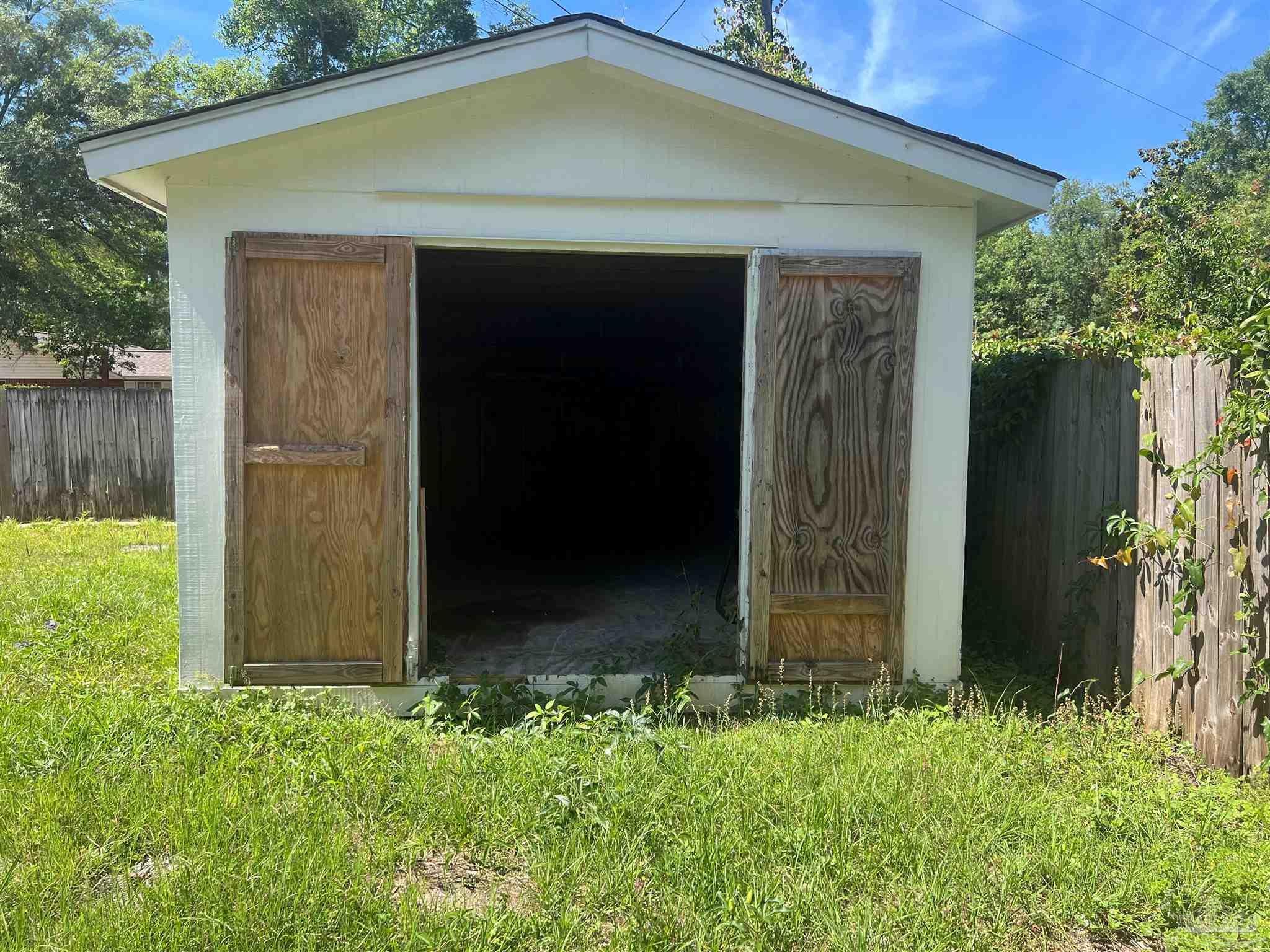3111 Holley Point Road Navarre, FL 32566 - Photo 23 of 23 an entrance to house with yard