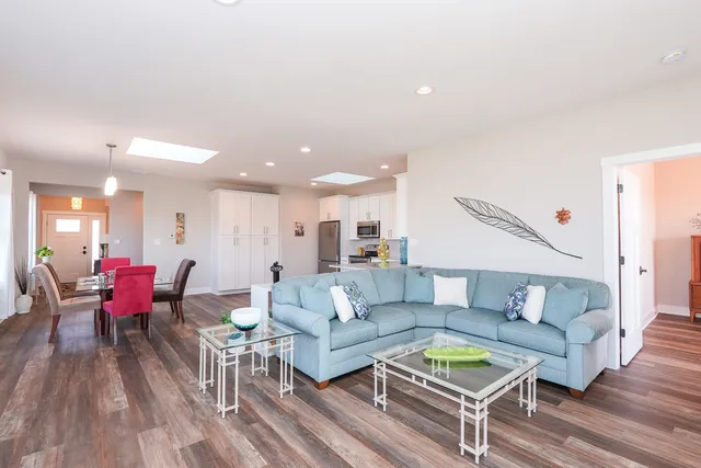 a bedroom with bed and wooden floor