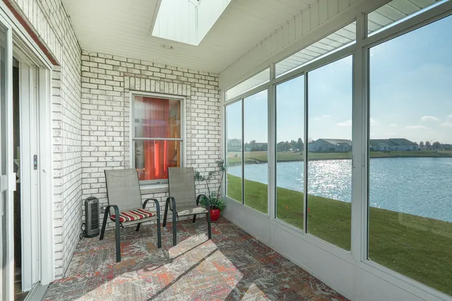 a view of a lake with houses in the back