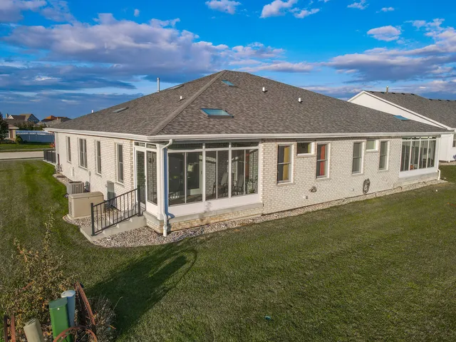 an aerial view of a city with ocean view