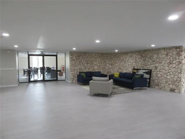 a group of people sitting in a living room