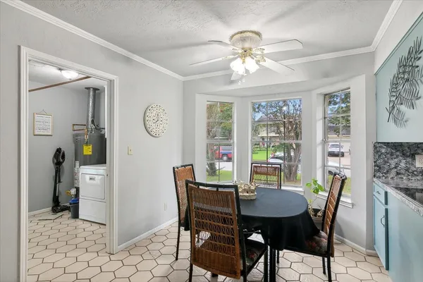 a view of a dining room with furniture window and outside view