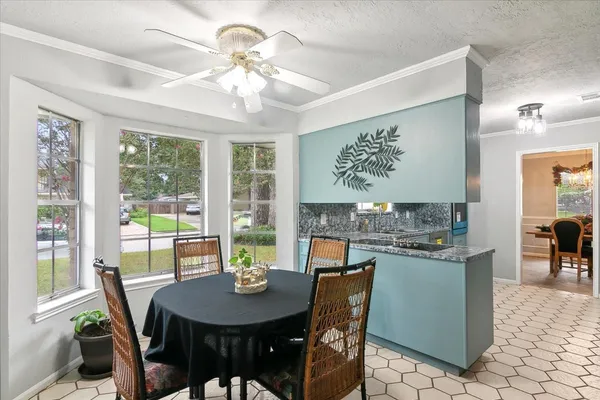 a kitchen with a sink a stove and cabinets