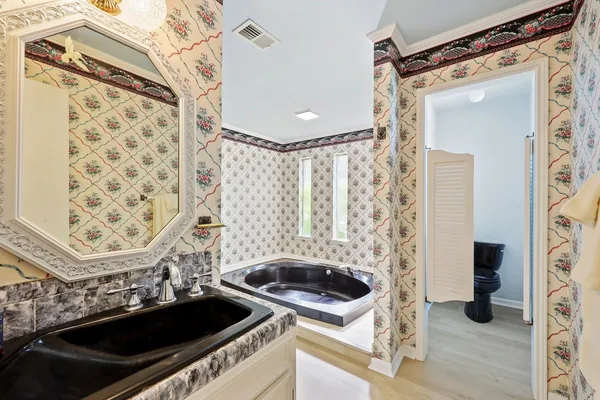 a kitchen with a sink and a stove top oven