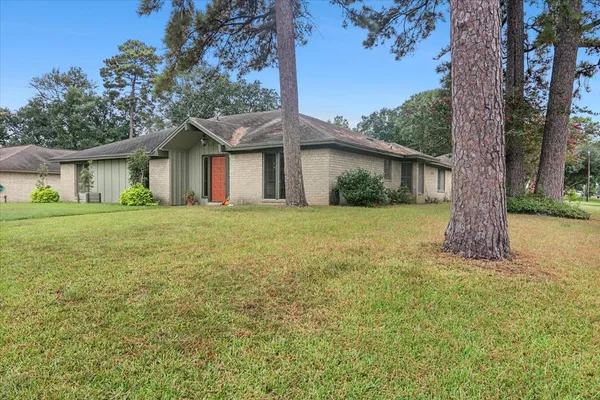 a house with garden in front of it