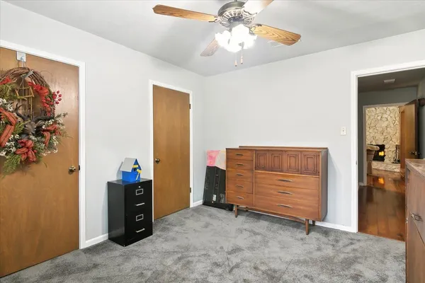 a bathroom with a sink vanity mirror and toilet