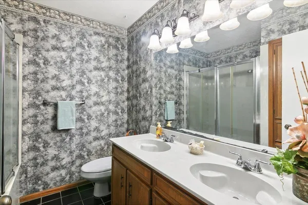 a view of a workspace with furniture and a chandelier