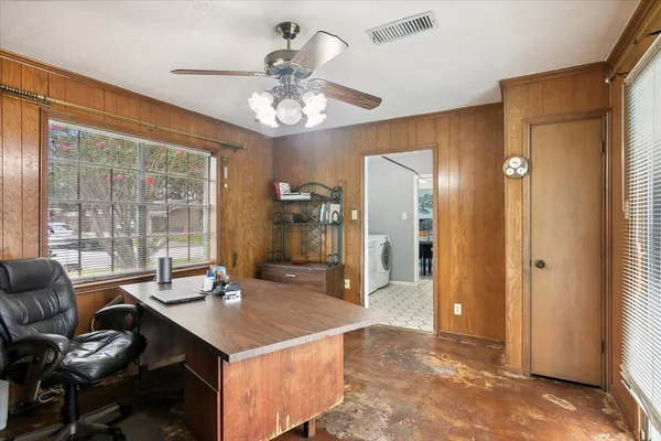 a bathroom with a granite countertop double sink and a mirror
