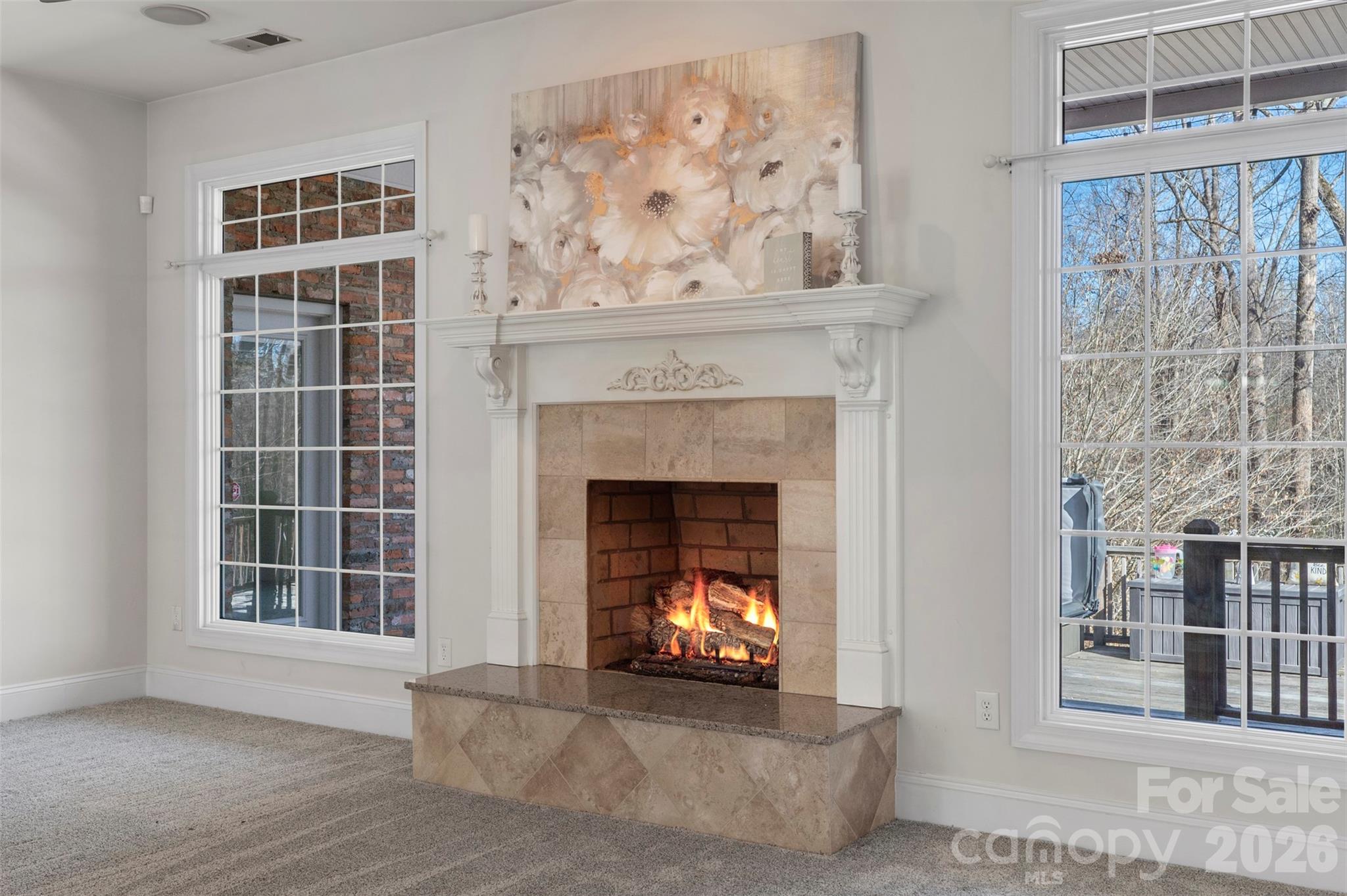 12711 Moores Chapel Road Charlotte, NC 28214 - Photo 20 of 48 a living room with a fireplace and a window