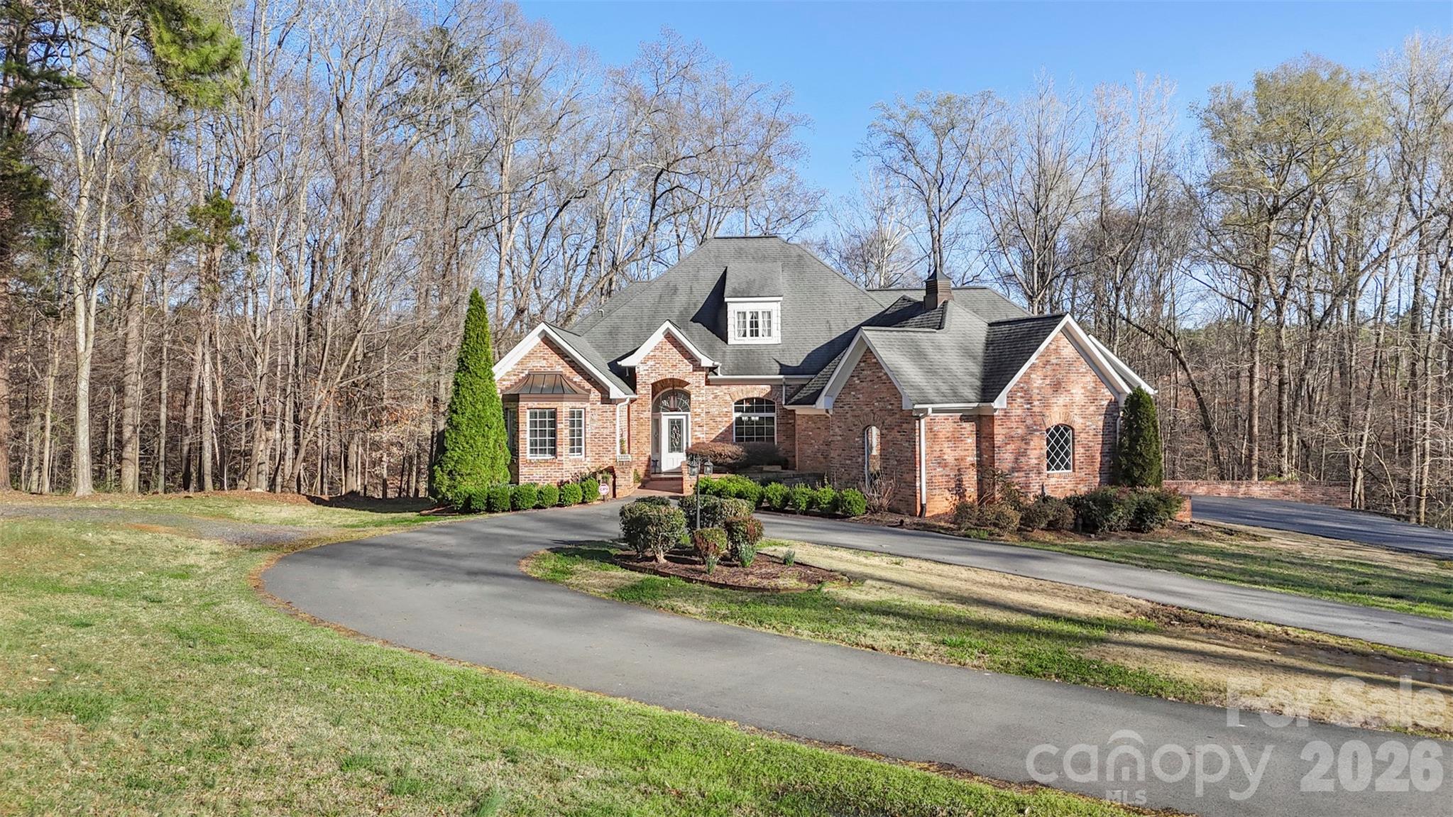 12711 Moores Chapel Road Charlotte, NC 28214 - Photo 2 of 48 a front view of a house with a yard