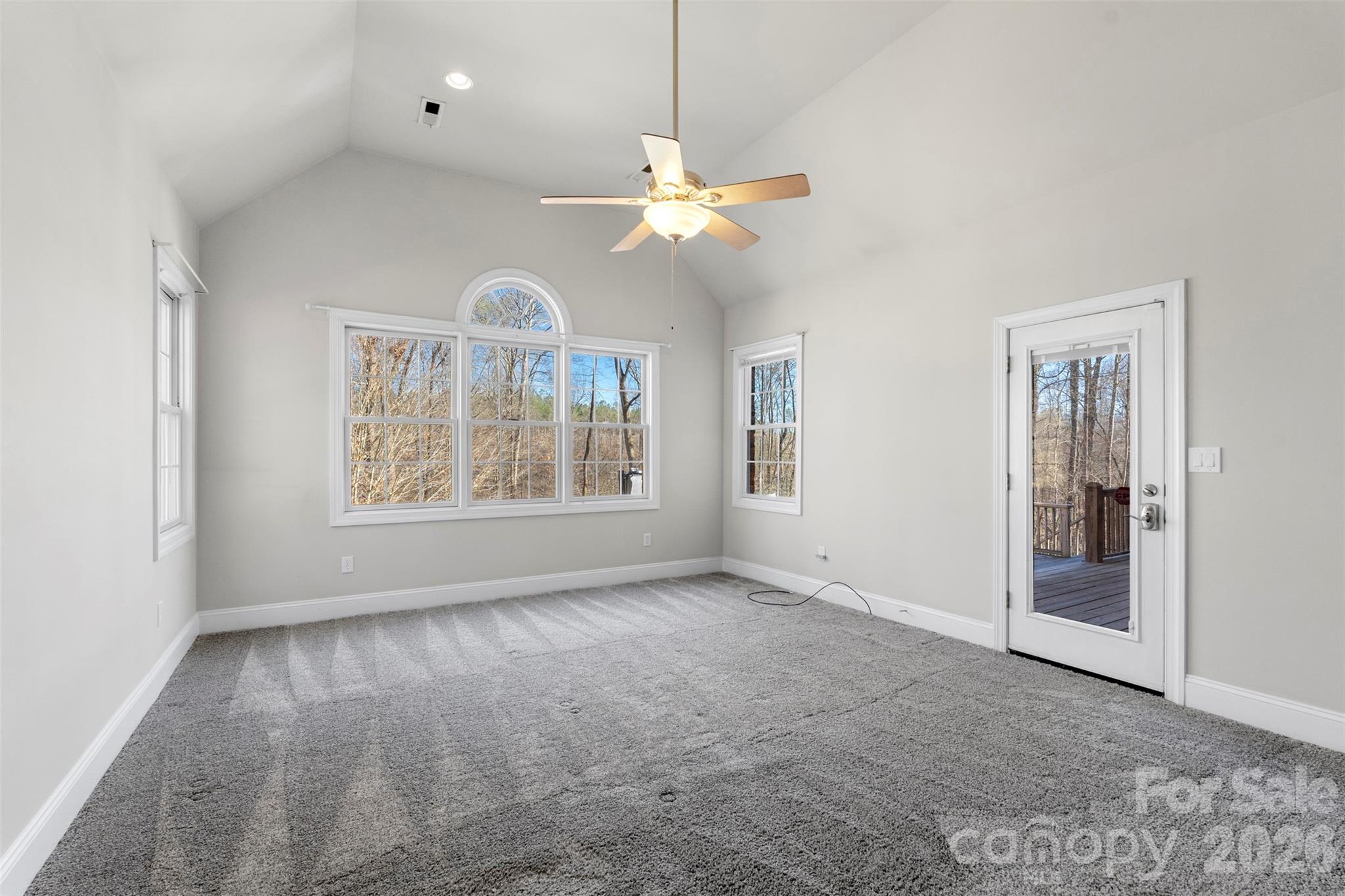 12711 Moores Chapel Road Charlotte, NC 28214 - Photo 22 of 48 an empty room with windows and fan