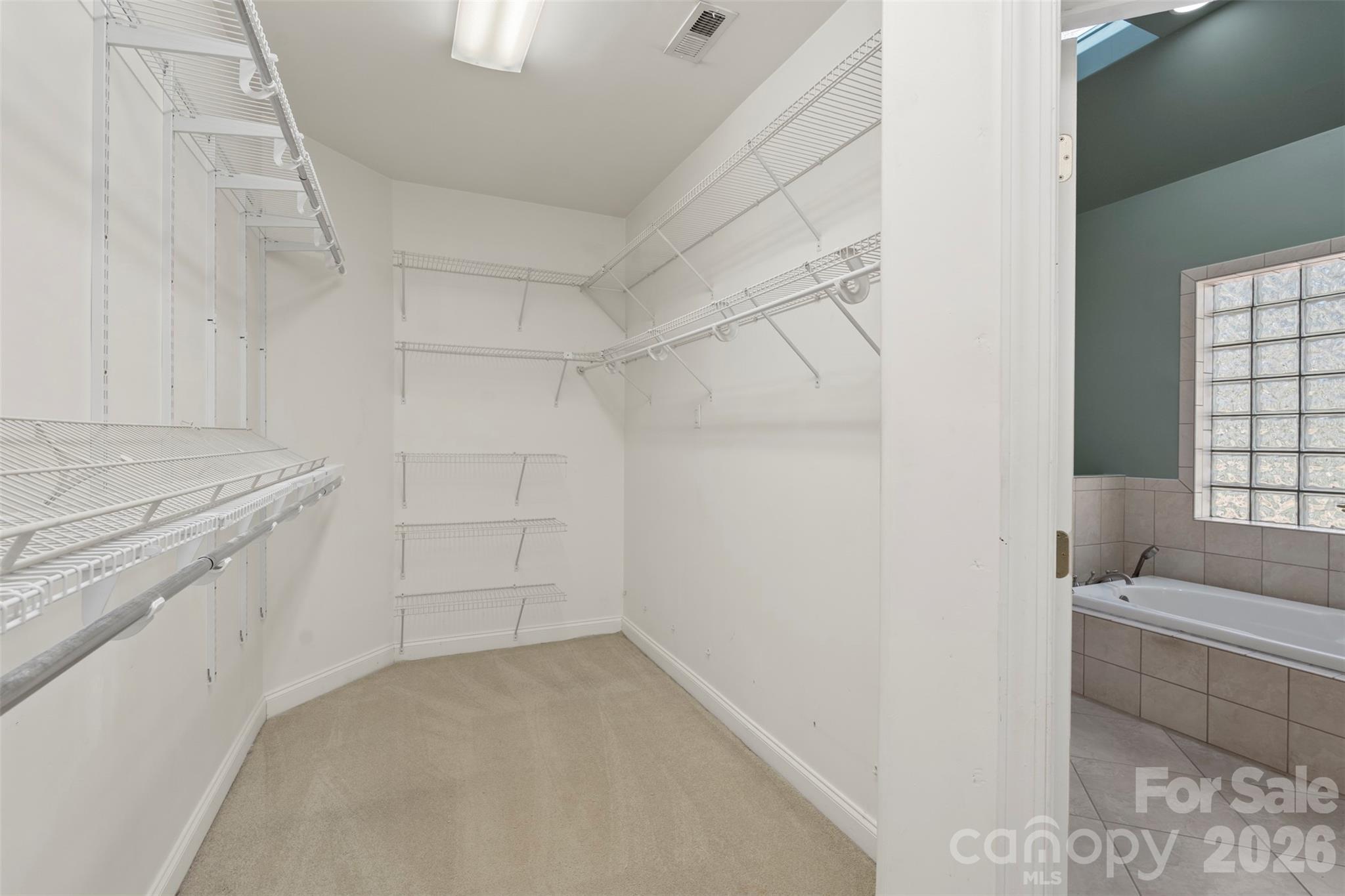 12711 Moores Chapel Road Charlotte, NC 28214 - Photo 25 of 48 a view of a kitchen with white cabinets and wooden floor