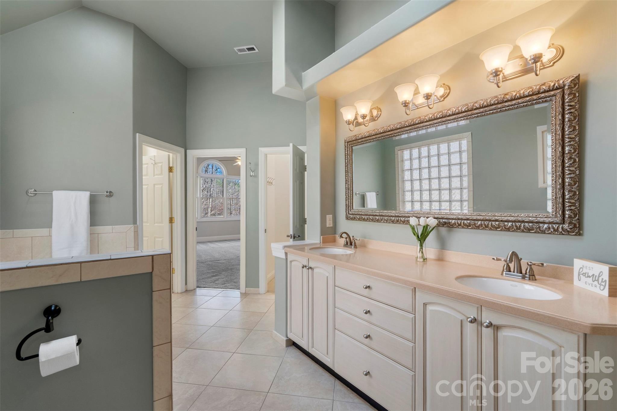 12711 Moores Chapel Road Charlotte, NC 28214 - Photo 26 of 48 a bathroom with double vanity sink and a mirror