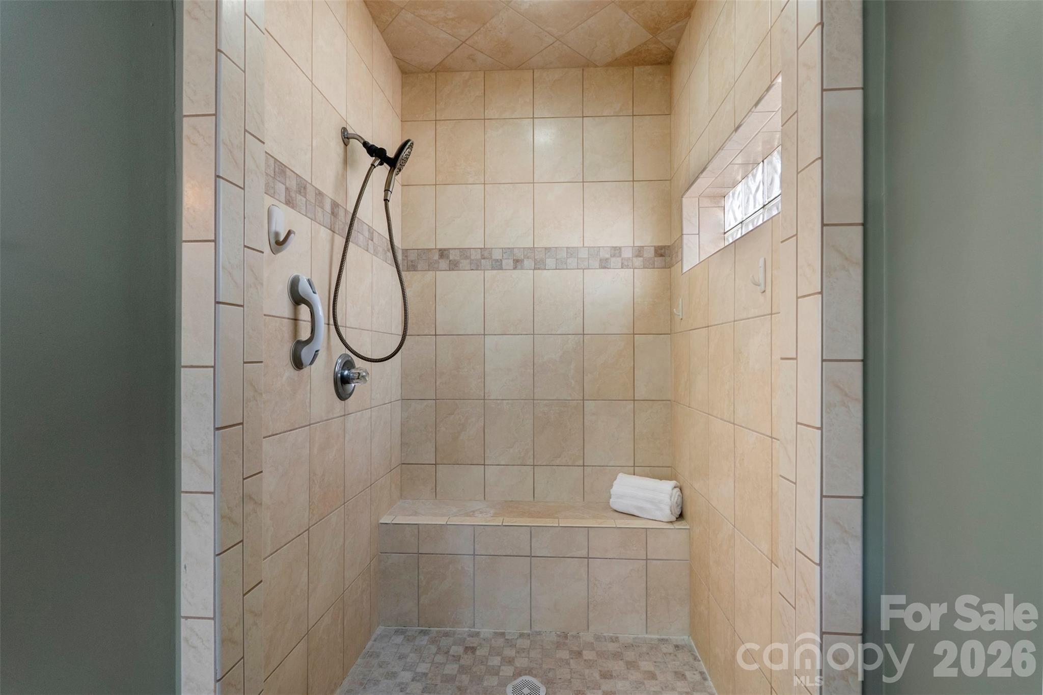 12711 Moores Chapel Road Charlotte, NC 28214 - Photo 28 of 48 a bathroom with a glass shower door