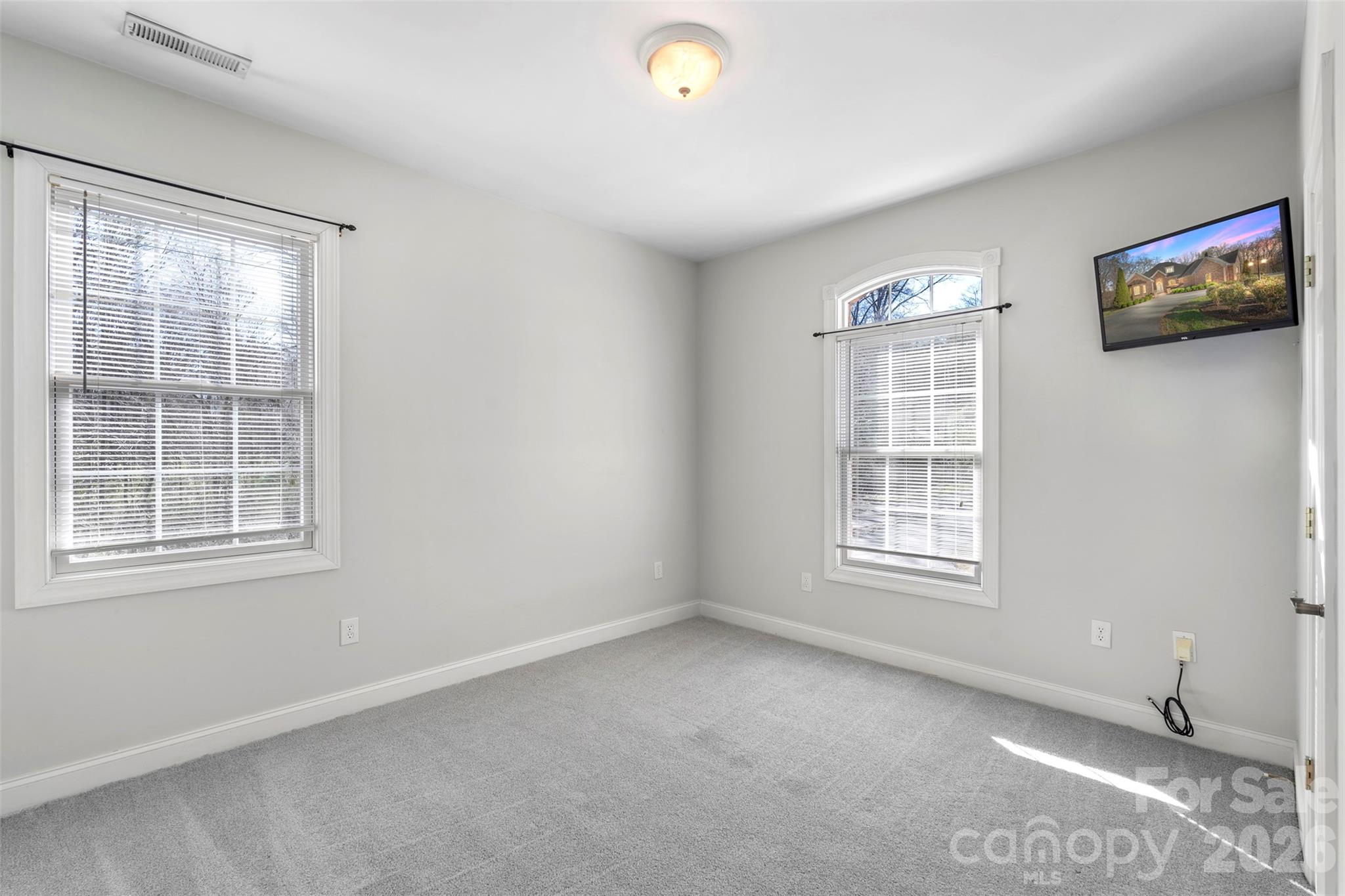 12711 Moores Chapel Road Charlotte, NC 28214 - Photo 29 of 48 an empty room with windows