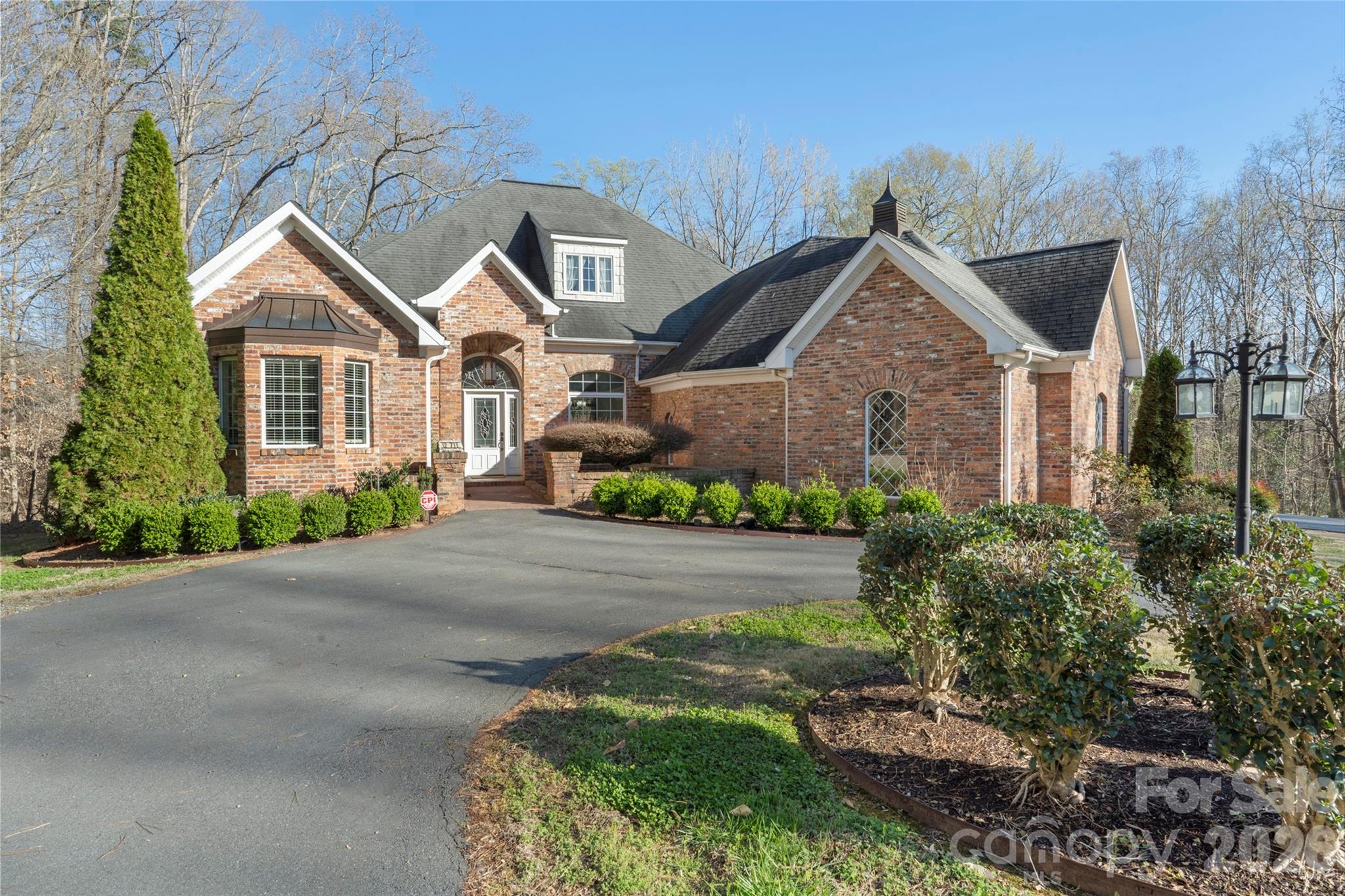 12711 Moores Chapel Road Charlotte, NC 28214 - Photo 3 of 48 front view of house with a yard and potted plants
