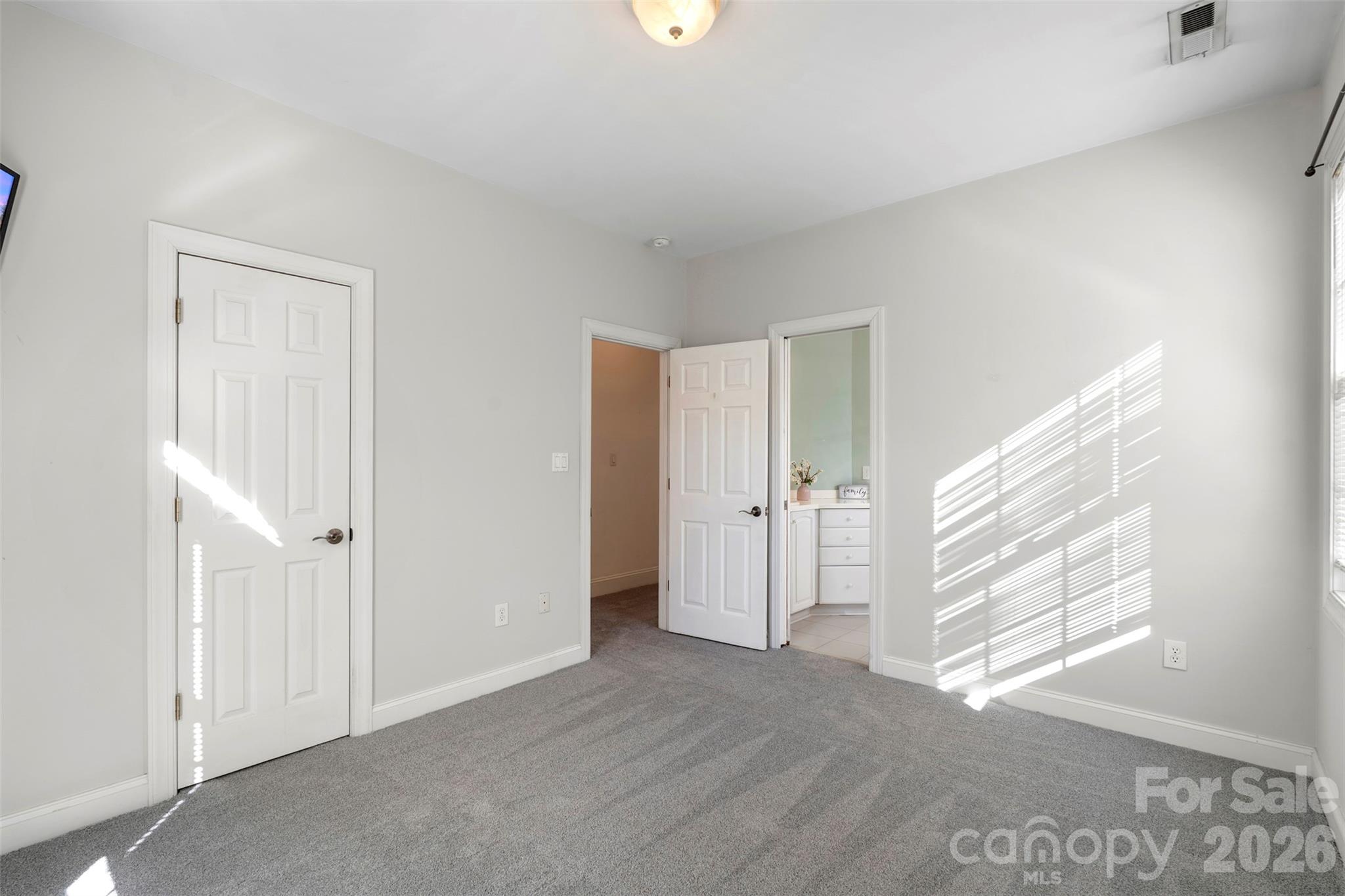 12711 Moores Chapel Road Charlotte, NC 28214 - Photo 32 of 48 a view of an empty room with window and closet area