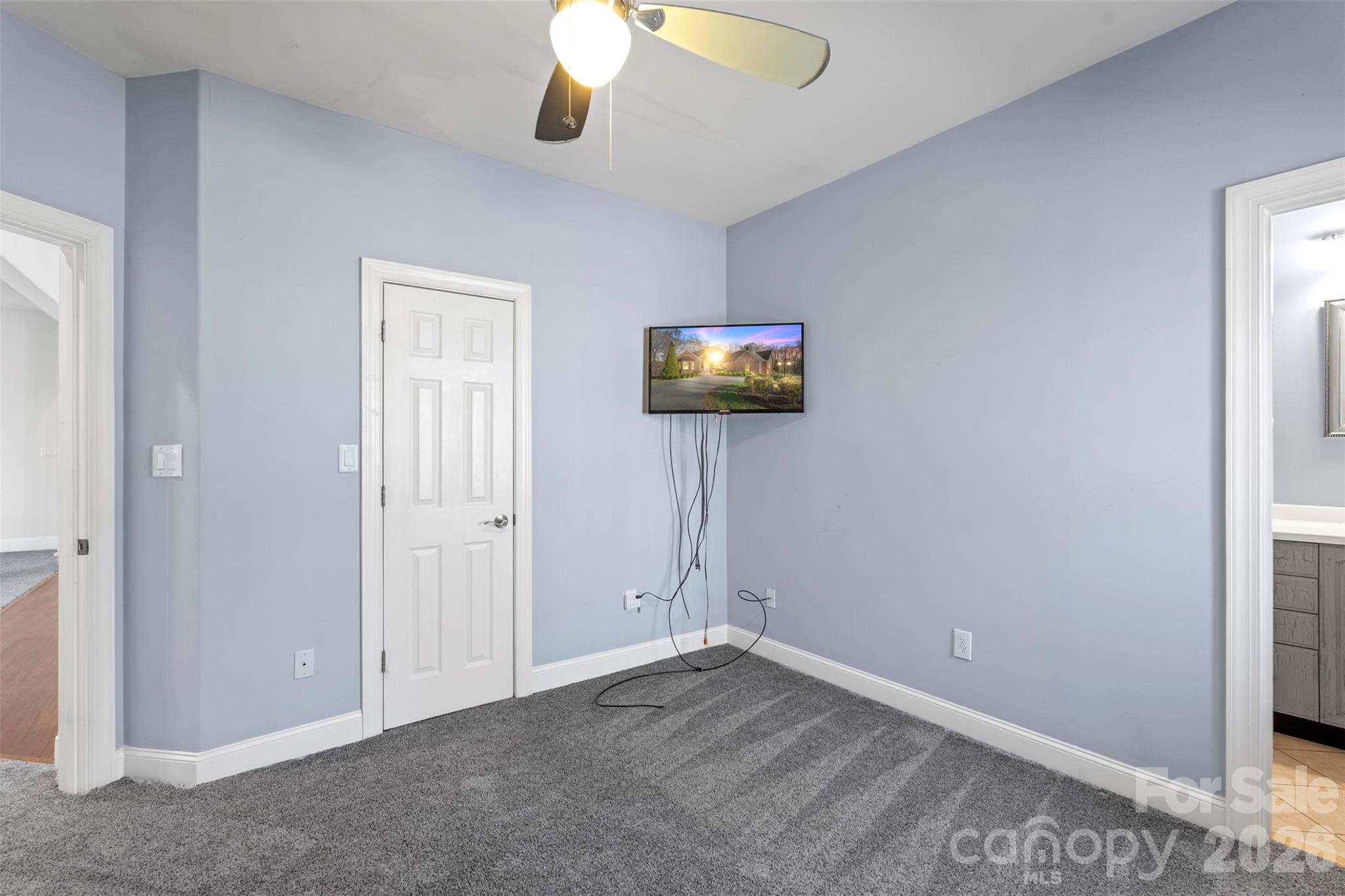 12711 Moores Chapel Road Charlotte, NC 28214 - Photo 34 of 48 an empty room with windows and fan