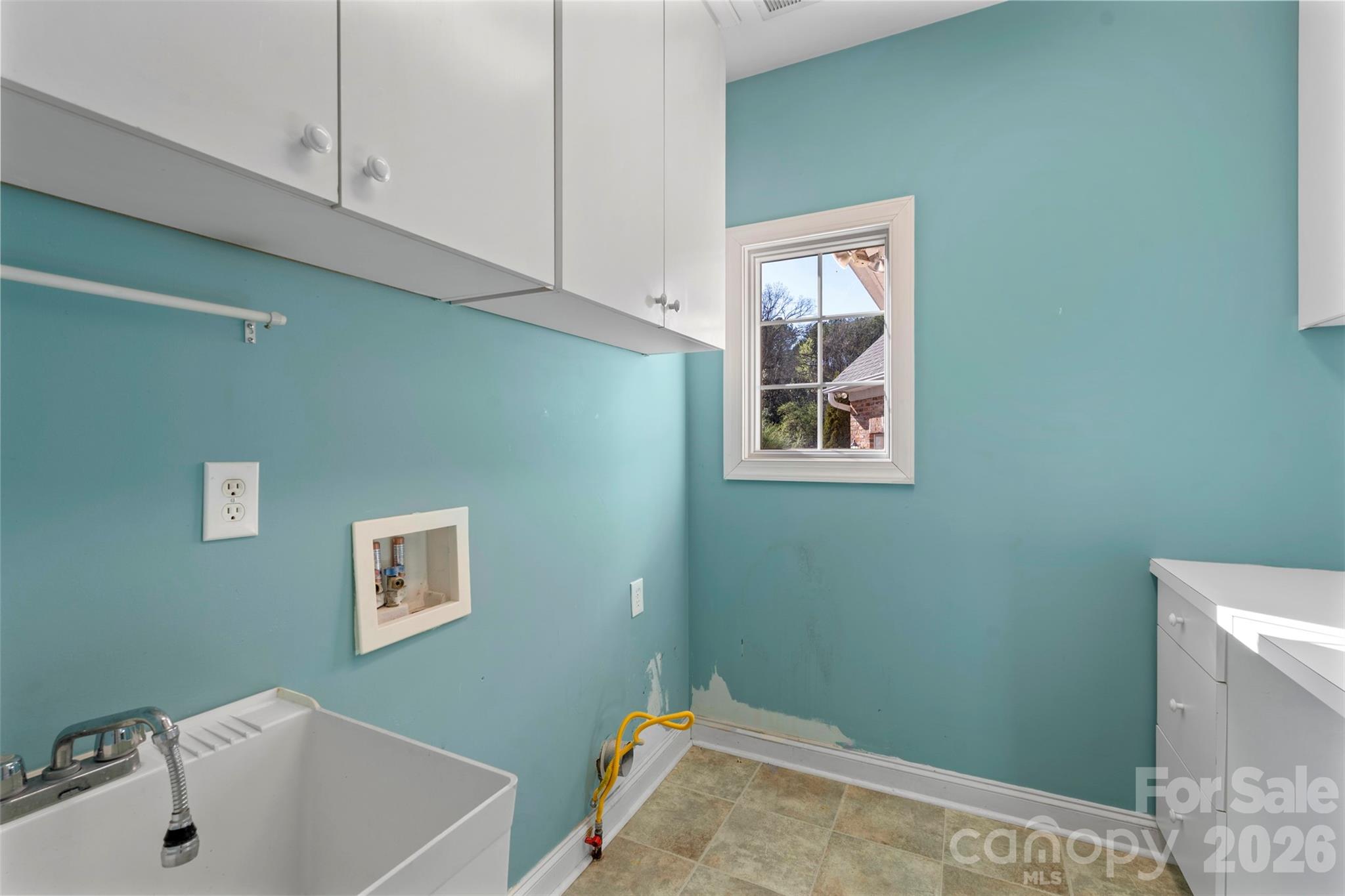 12711 Moores Chapel Road Charlotte, NC 28214 - Photo 36 of 48 a bathroom with a sink and a window