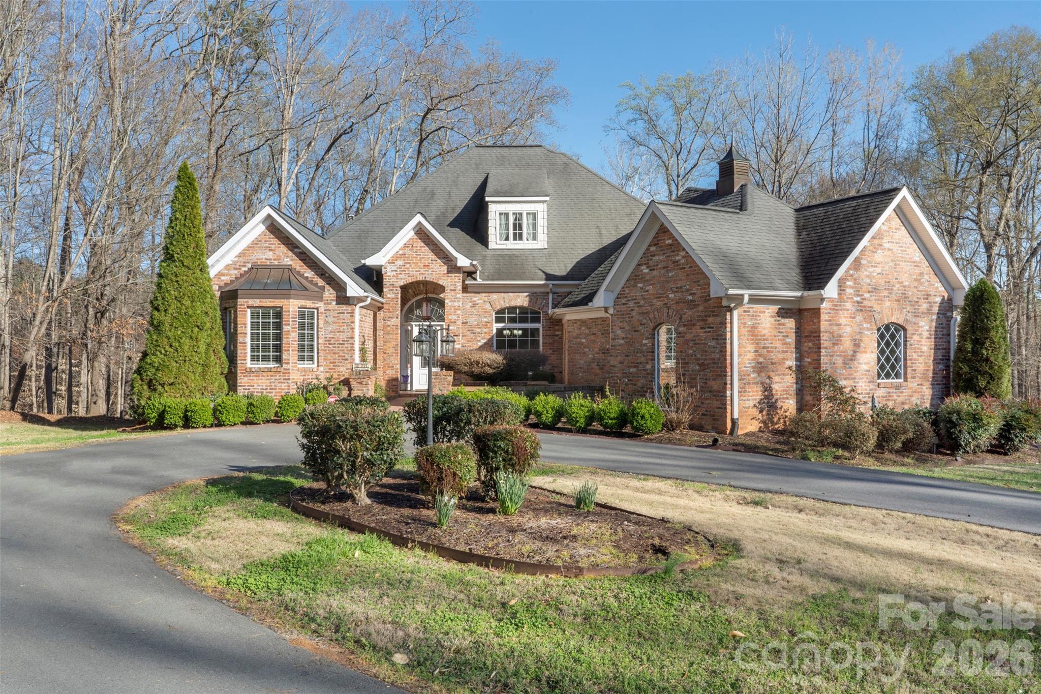 12711 Moores Chapel Road Charlotte, NC 28214 - Photo 7 of 48 a front view of house with yard and trees around