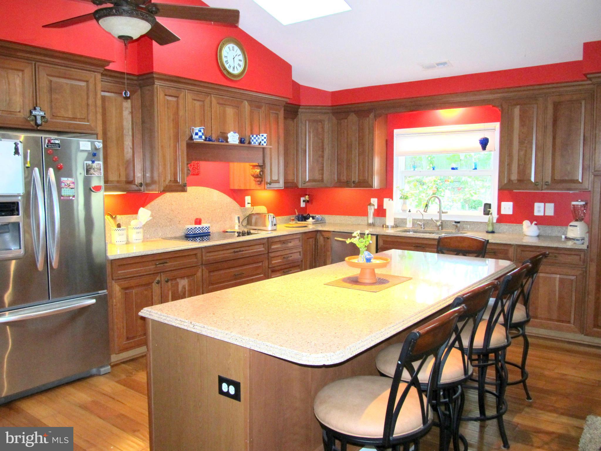 6206 Medora Road Linthicum, MD 21090 - Photo 2 of 30 a kitchen with stainless steel appliances dining table and chairs
