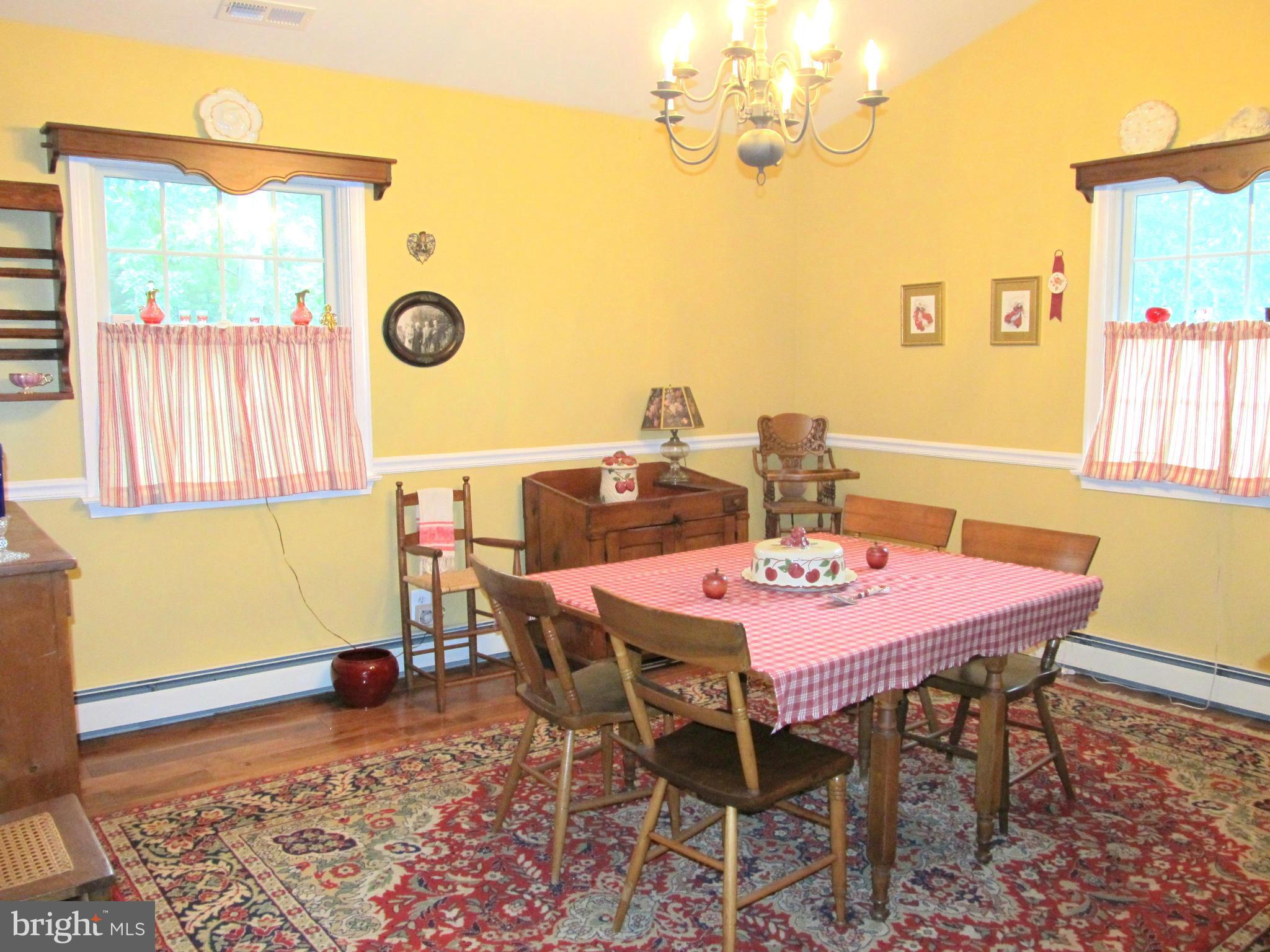 6206 Medora Road Linthicum, MD 21090 - Photo 11 of 30 a view of a dining room with furniture and wooden floor