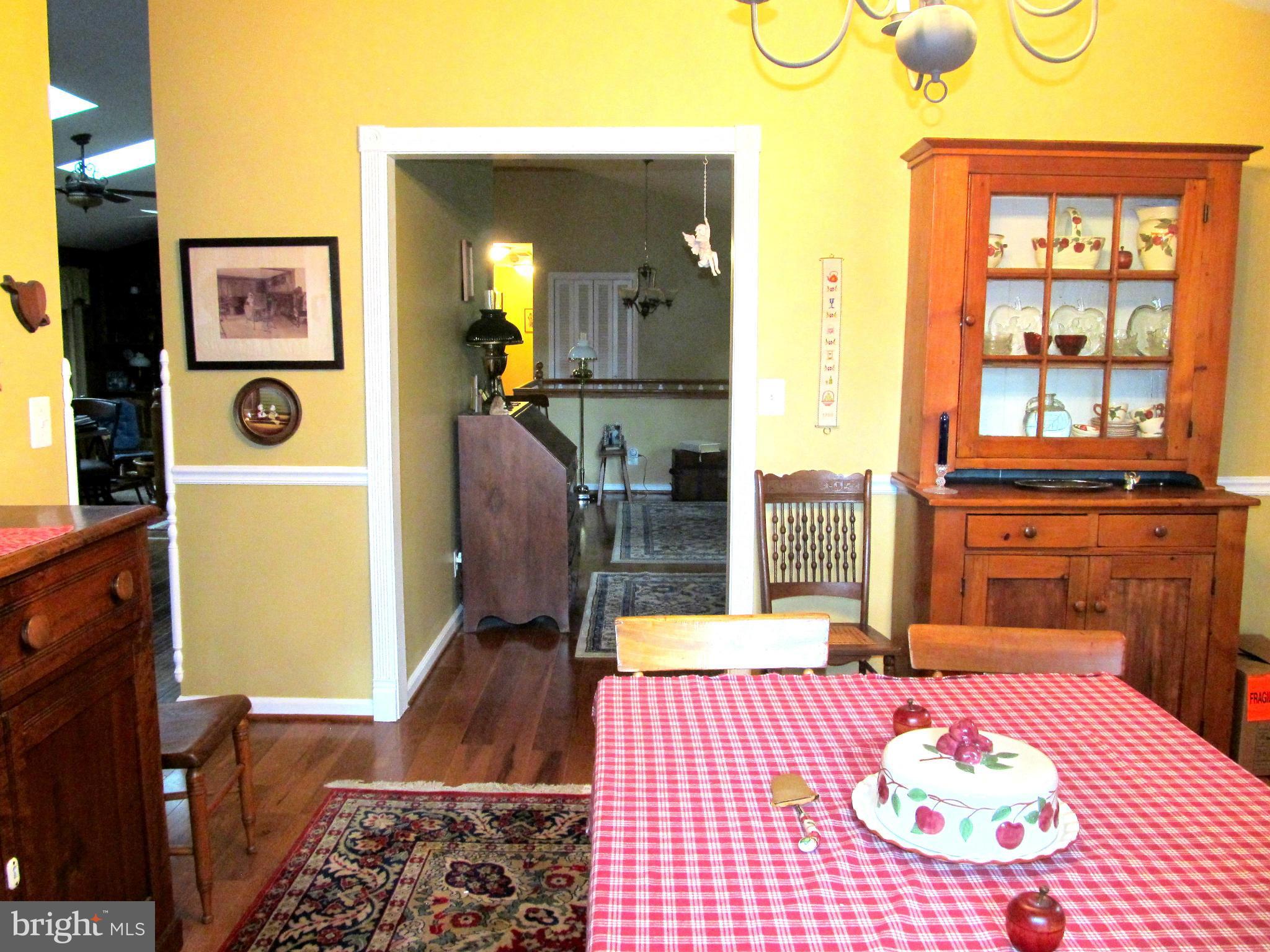 6206 Medora Road Linthicum, MD 21090 - Photo 12 of 30 a bedroom with a bed and wooden floor