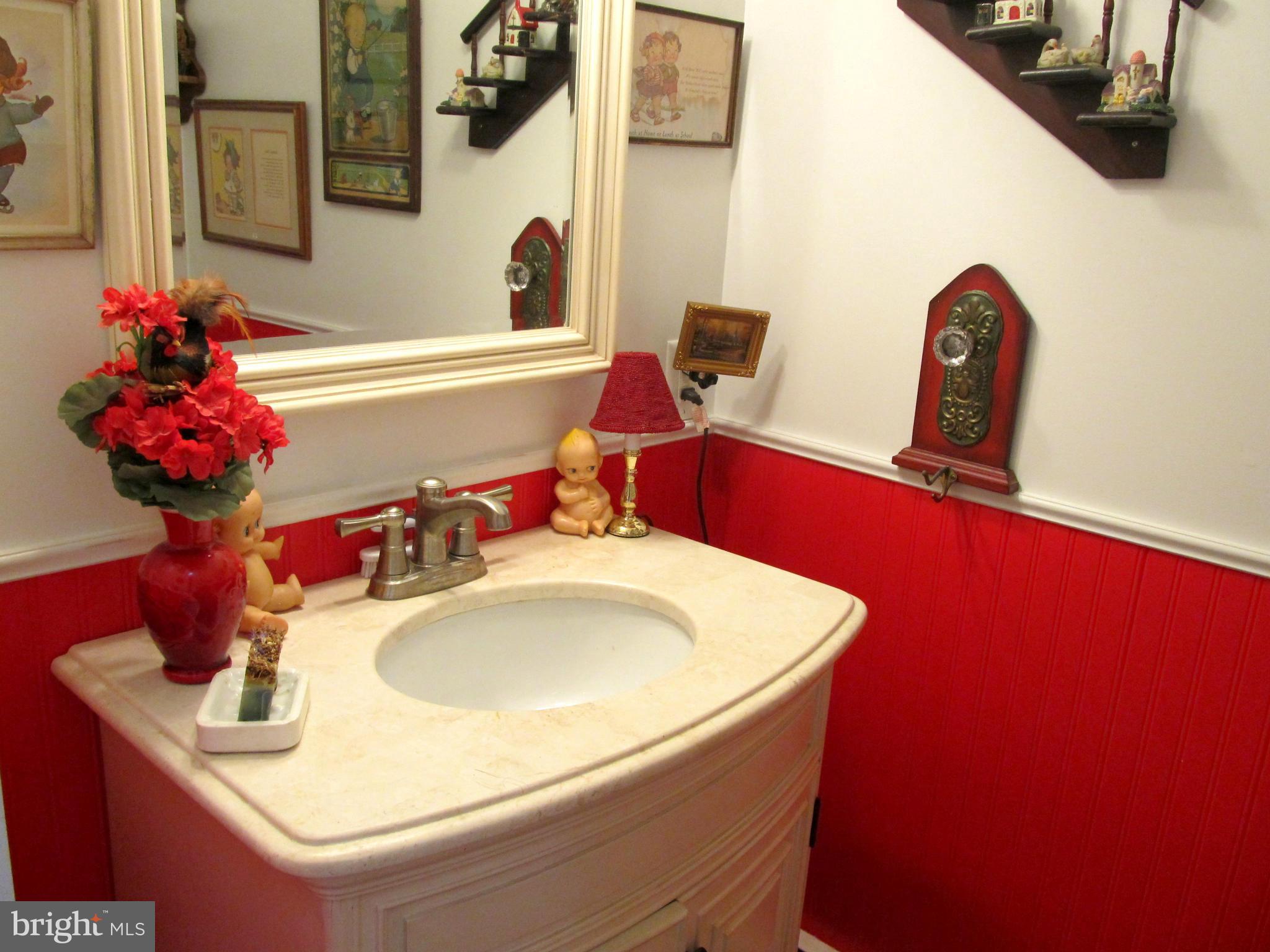 6206 Medora Road Linthicum, MD 21090 - Photo 16 of 30 a bathroom with a sink and a mirror