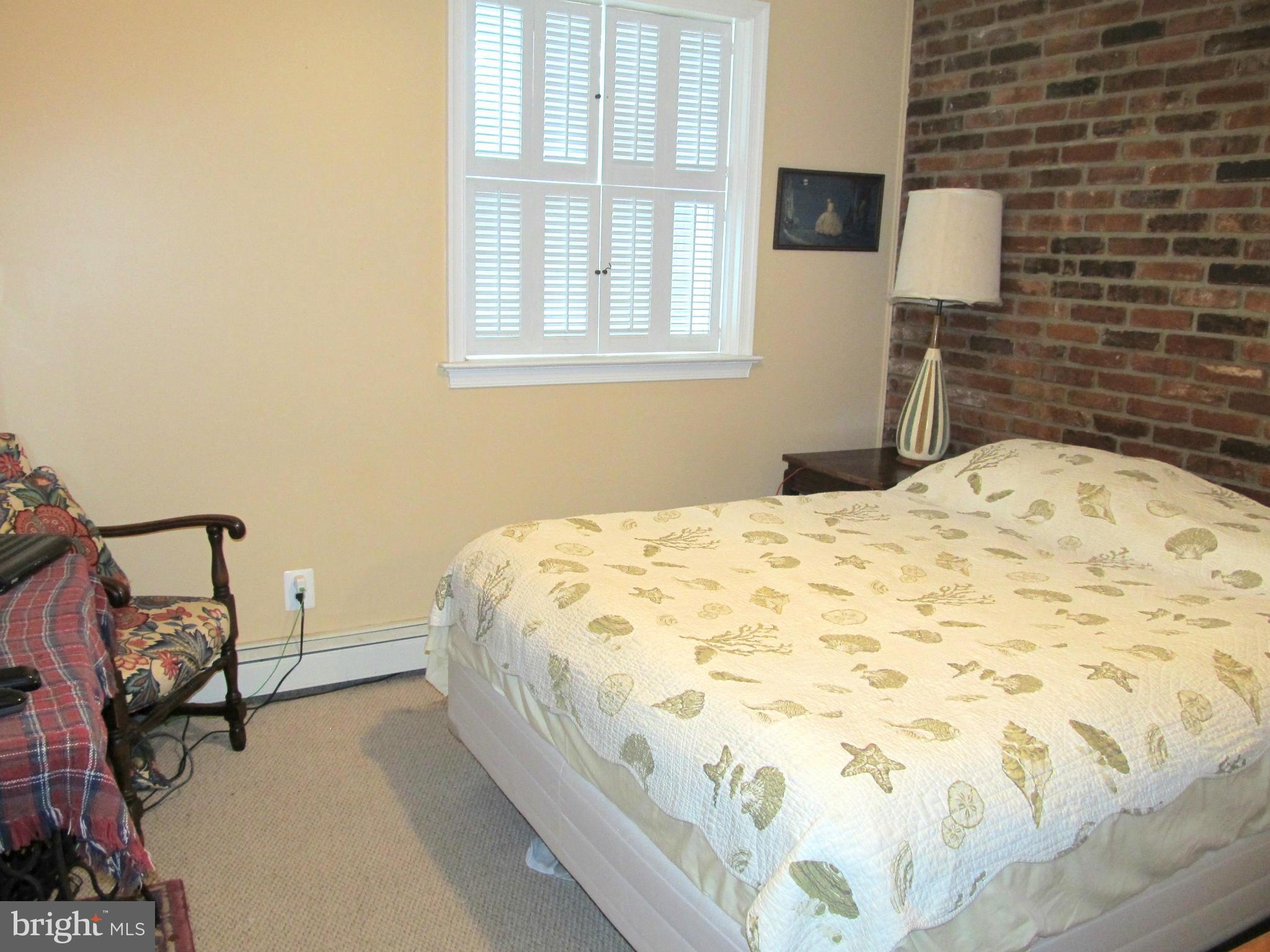 6206 Medora Road Linthicum, MD 21090 - Photo 20 of 30 a bedroom with a bed and a window