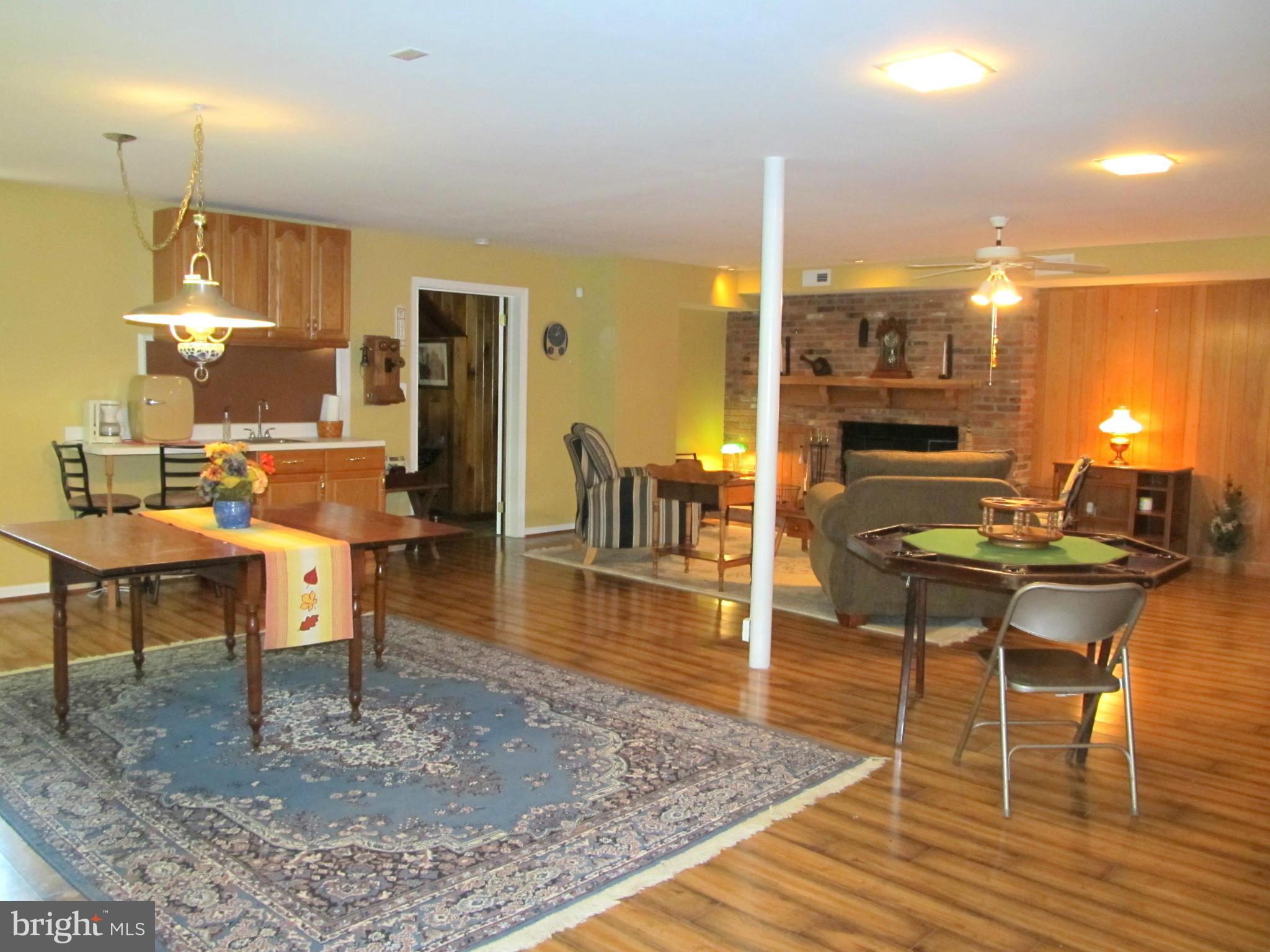6206 Medora Road Linthicum, MD 21090 - Photo 21 of 30 a living room with dining room and wooden floor