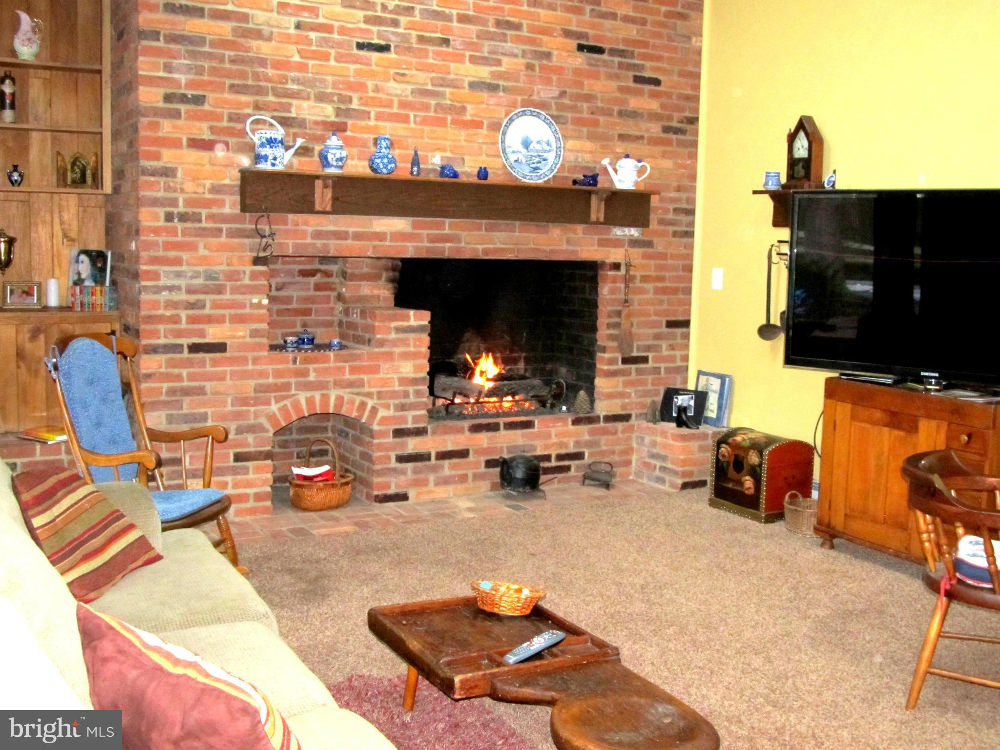 6206 Medora Road Linthicum, MD 21090 - Photo 8 of 30 a building outdoor space with patio furniture and a fireplace