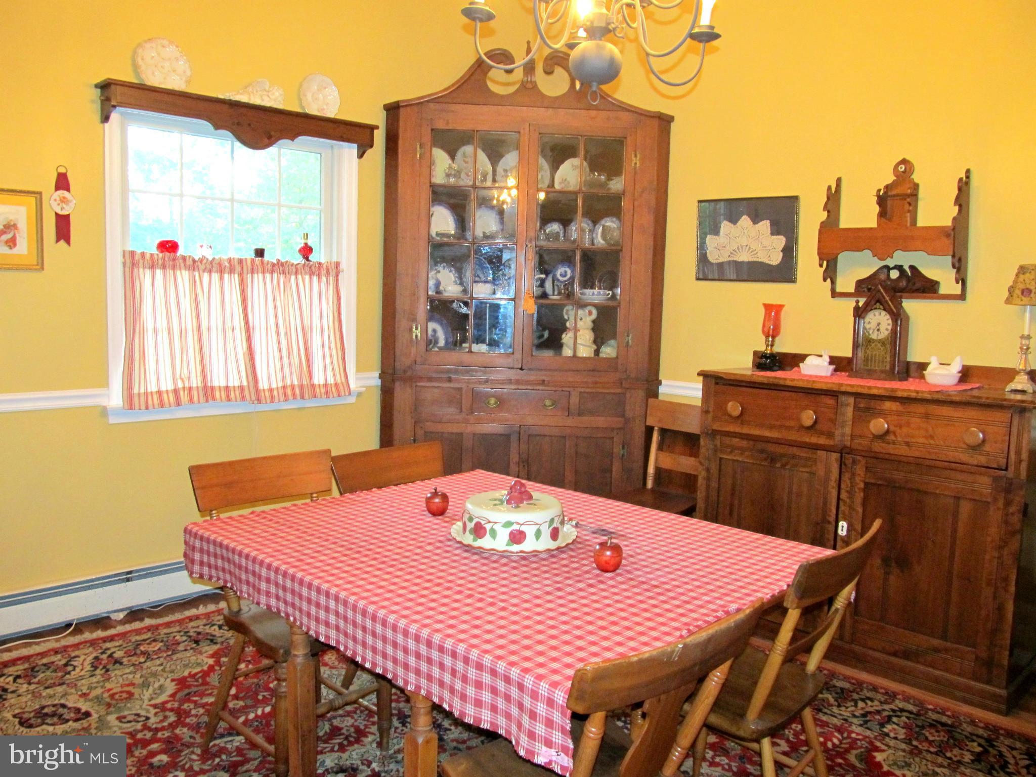 6206 Medora Road Linthicum, MD 21090 - Photo 10 of 30 a dining room with a table and chairs