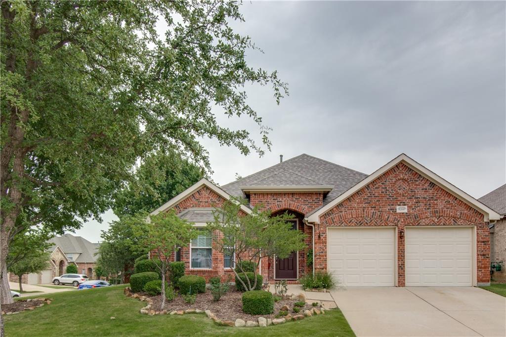 8200 Watson Road Lantana, TX 76226 - Photo 1 of 1 a front view of a house with garden