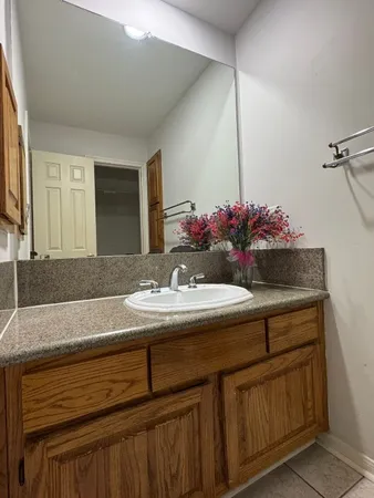 a white bath tub sitting next to a white toilet