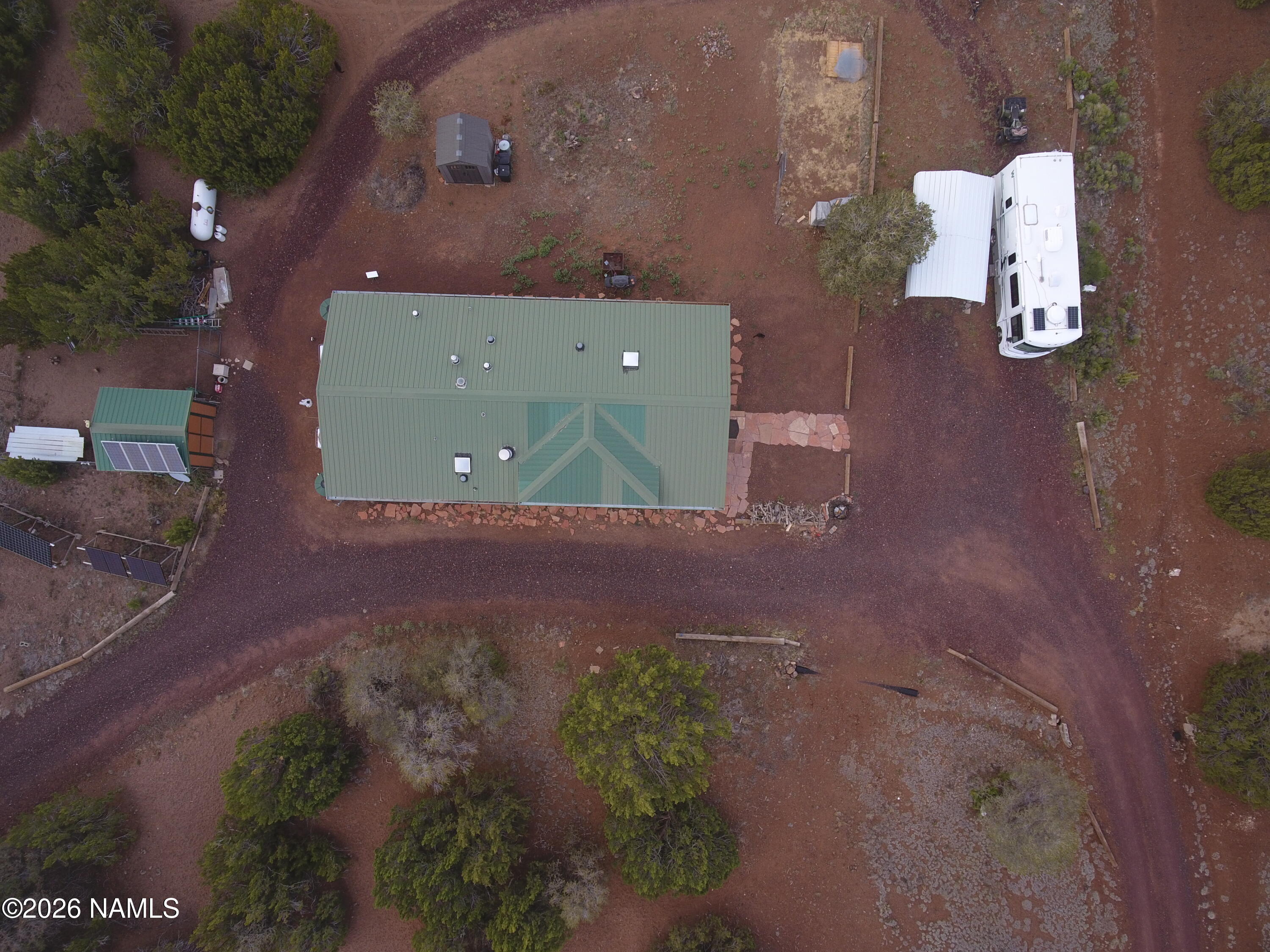 1431 East Cedar Road Williams, AZ 86046 - Photo 44 of 51 an aerial view of a house with a yard
