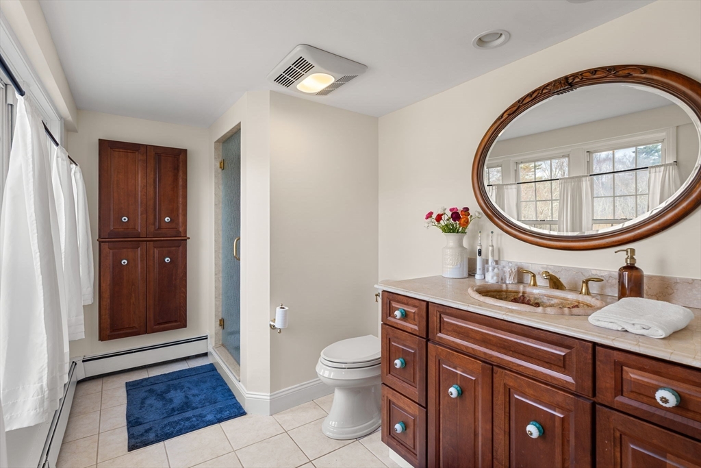 437 Linebrook Road Ipswich, MA 01938 - Photo 20 of 41 a bathroom with a toilet a sink and a mirror